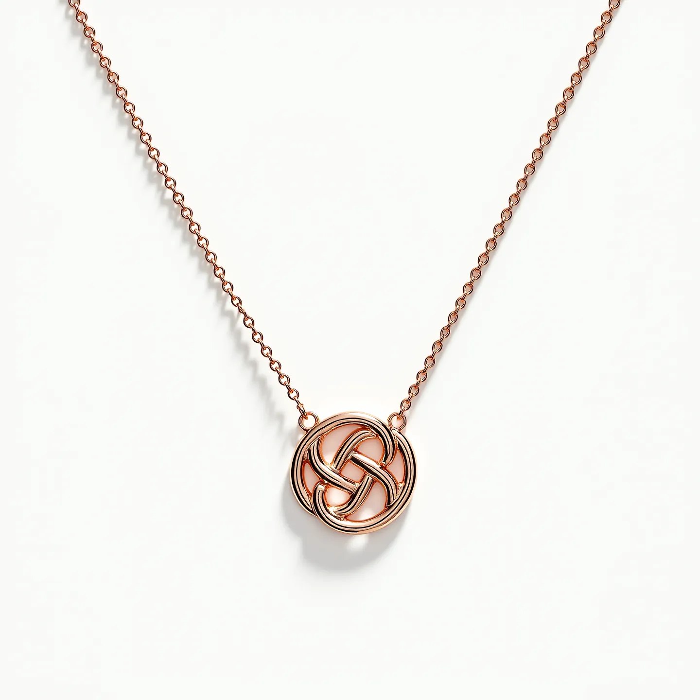 This interlocking circle necklace features a beautifully intricate design with polished metallic loops, likely made of rose gold or a similar metal, which interlace to form an intricate pattern. The central pendant is attached to a fine chain, which appears to complement the pendant's elegant appearance. There are no visible gems or stones incorporated into the design, allowing the metallic sheen to stand out prominently. The necklace is secured with a simple yet effective clasp, ensuring ease of wear while maintaining a seamless aesthetic.