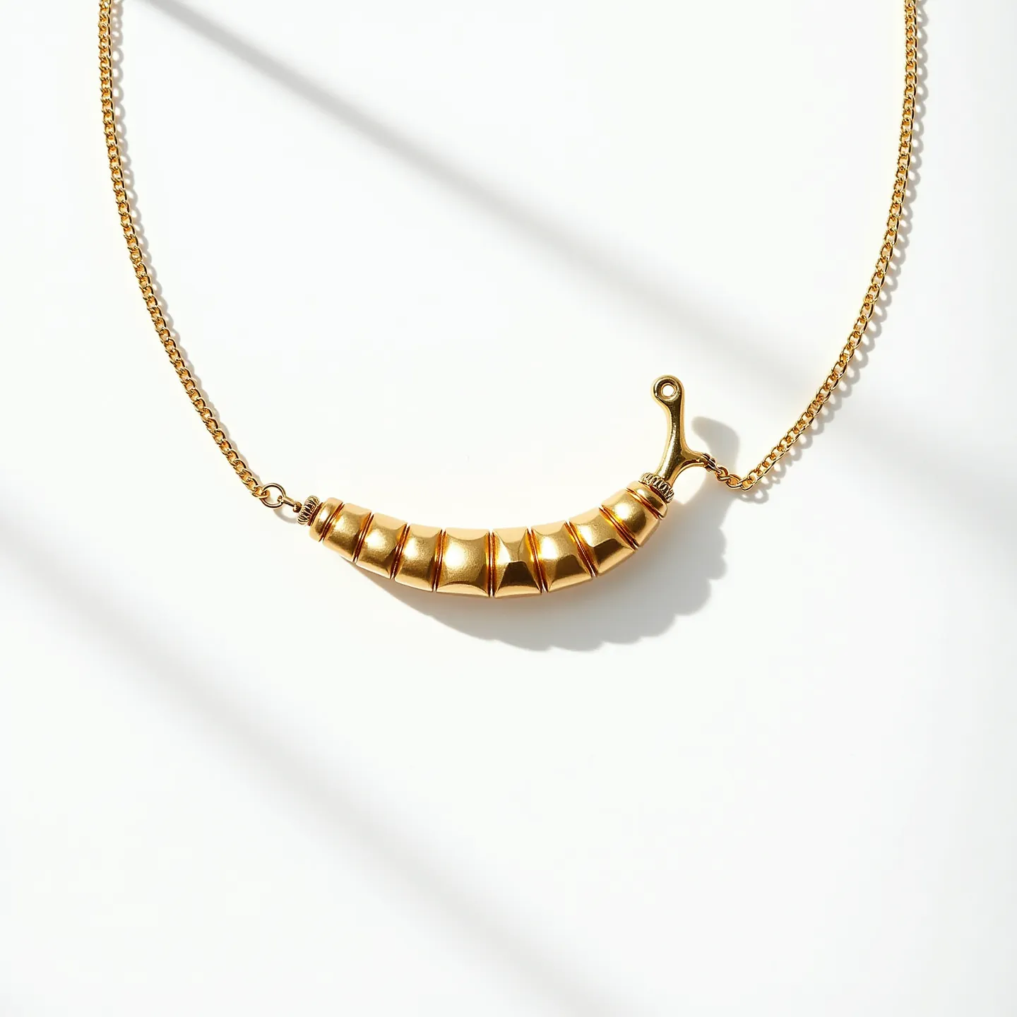 This Italian pepper necklace features a sleek and polished design with a pepper-shaped pendant crafted from gold-toned metal, giving it a vibrant and luxurious appearance. The pendant is connected to a fine gold-colored chain that enhances its elegance. The necklace employs a classic clasp mechanism, providing security and ease of wear. The chain is delicate yet sturdy, complementing the striking design of the pepper motif. Overall, this necklace effectively captures the bold yet refined aesthetic often associated with Italian craftsmanship.