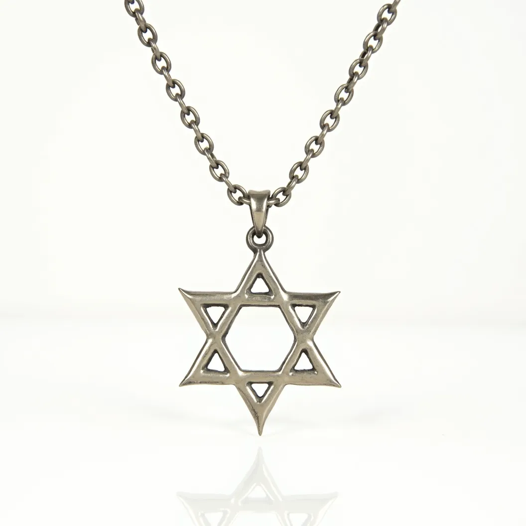 This Jewish star necklace features a Star of David pendant crafted from a metallic material, likely silver or stainless steel, lending it a classic and durable appearance. The design is minimalist, with clean lines accentuating the geometric shape of the star. The pendant is attached to a chain via a simple, matching metallic bail that seamlessly integrates with the overall design. The chain itself is composed of interlocking round links, providing a sturdy and complementary aesthetic to the pendant. The clasp is a traditional lobster clasp, offering both security and ease of use for the wearer.