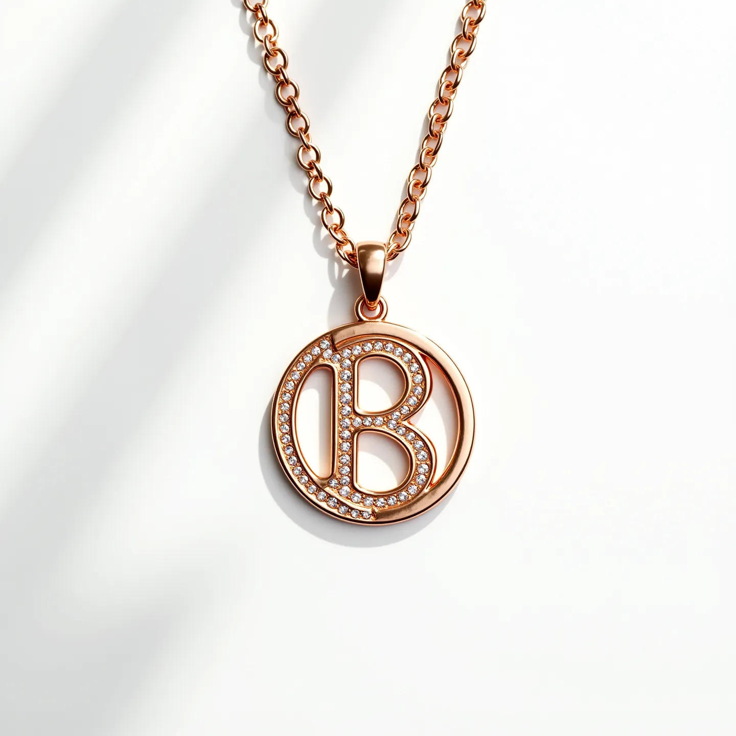 This kids gold necklace features a pendant with the letter "B" encased within a circular frame. The gold material provides a classic and elegant appearance. The letter "B" is adorned with small, round gemstones, likely cubic zirconia or diamonds, which are set in a pave style, creating a sparkling effect. The chain is a simple yet sturdy link chain, providing durability and security for a child. The necklace includes a polished bail connecting the pendant to the chain.