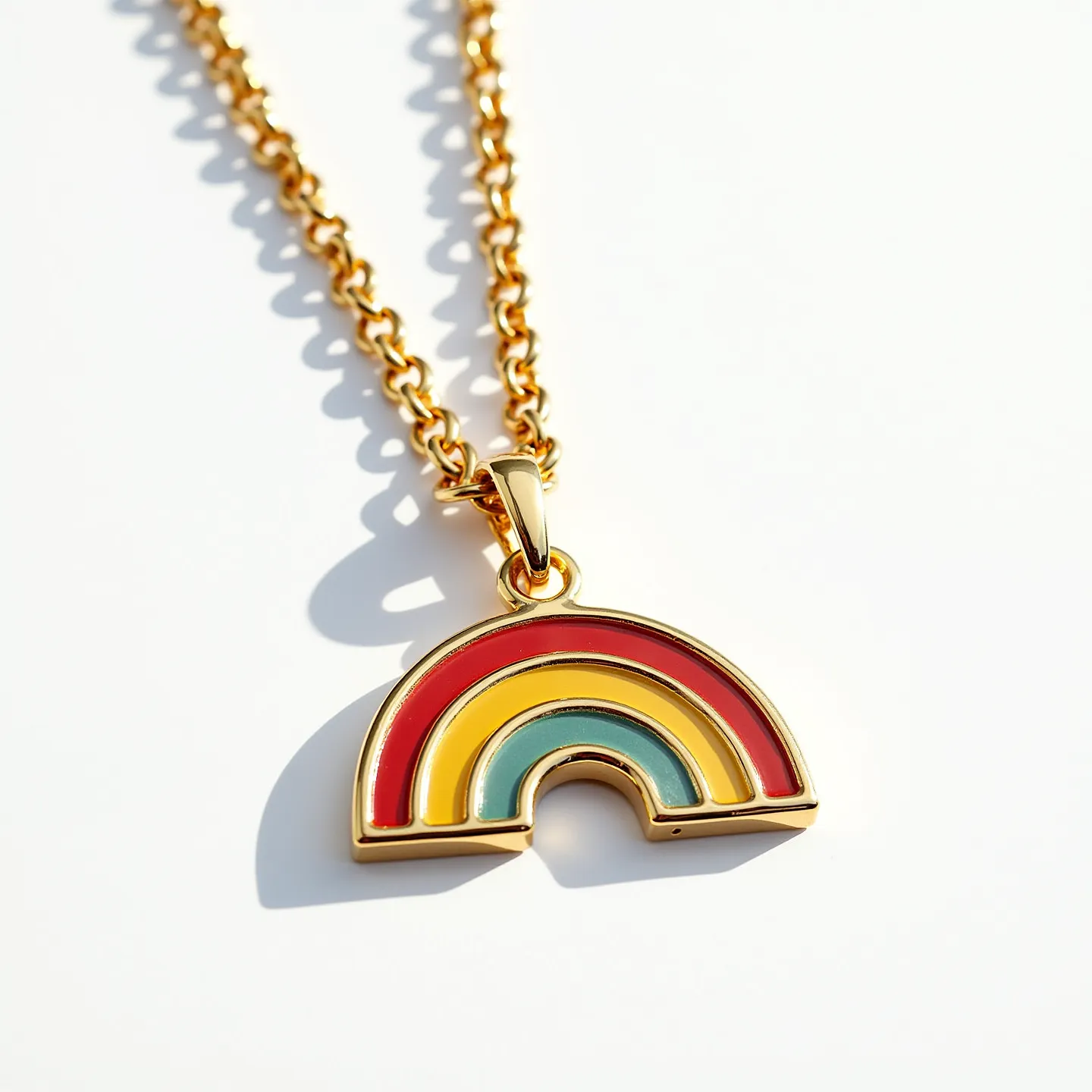 This kids gold necklace features a whimsical rainbow pendant, crafted with sleek gold outlining and vibrant enamel colors, including red, yellow, and blue-green, forming the arcs of the rainbow. The chain is composed of polished gold links, providing a delicate yet sturdy appearance suitable for children. At the top of the pendant, a small gold bail connects the rainbow charm to the chain, allowing for smooth movement and adding a touch of elegance. The necklace likely includes a simple yet secure clasp, ensuring ease of wear and safety for daily use. Overall, the design combines playful elements with refined materials, making it an appealing piece for children.