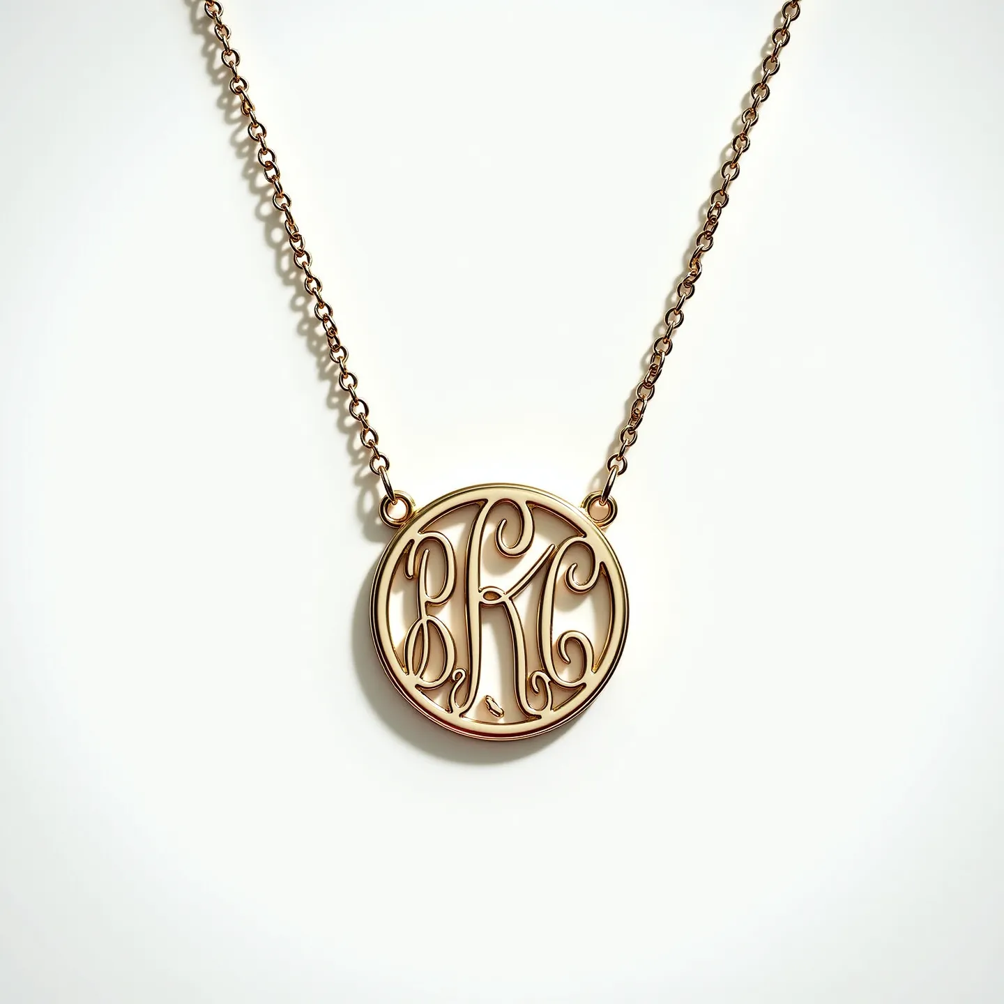 This kids gold necklace features a delicate chain and a monogram pendant. The pendant is crafted from gold and showcases intricate script initials elegantly enclosed within a circular frame. The chain appears to be lightweight and possibly made of a fine gold link, offering a subtle elegance suitable for children. The design does not feature any gemstones, emphasizing the personalized monogram as the focal point. The necklace is likely equipped with a simple yet secure clasp to ensure durability and ease of wear for a child.