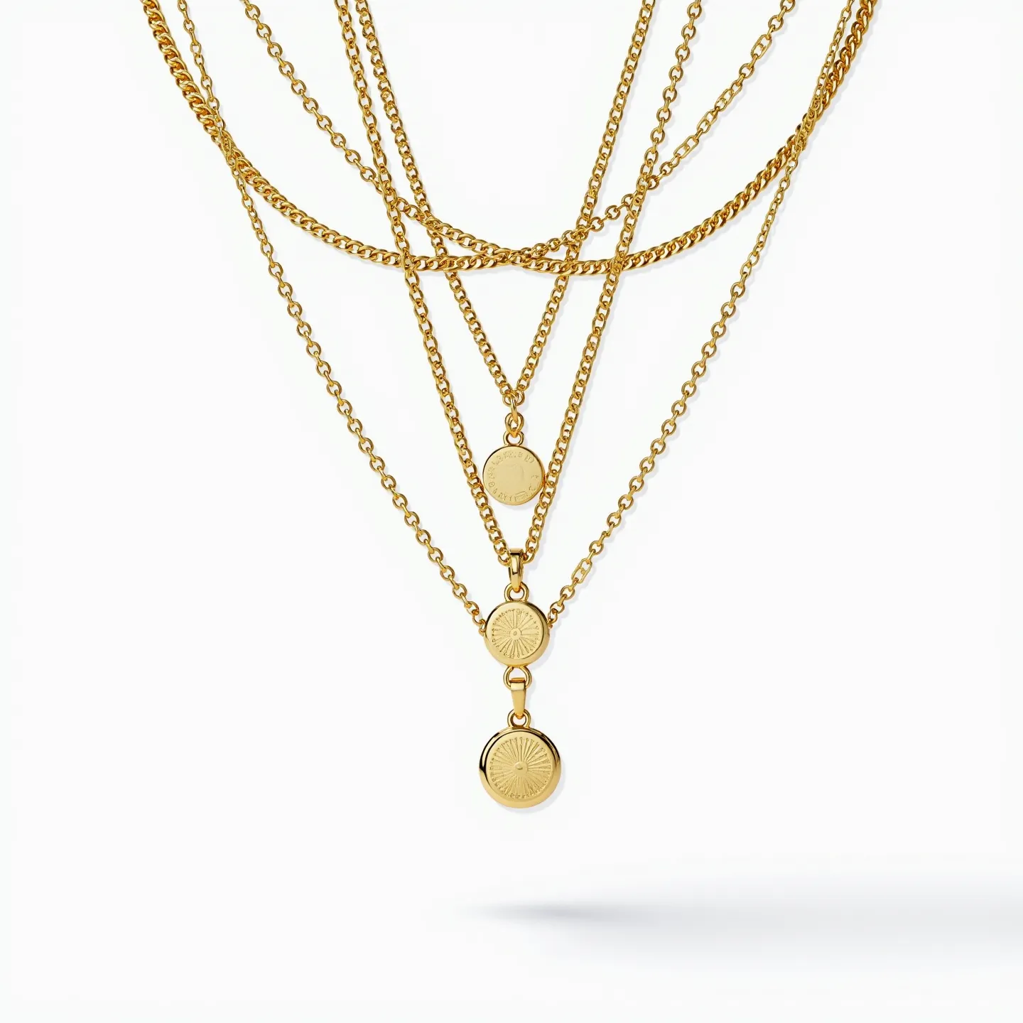 This layered necklace features multiple gold-toned chains of varying lengths, creating a cascading effect. Each layer hosts a small, round pendant with a sunburst design, accentuating the overall aesthetic with uniform circular patterns. The pendants are seamless in their attachment, contributing to the necklace's cohesive look. The chains likely secure with a standard clasp, maintaining an elegant and simple closure at the back. The overall design offers a harmonious blend of symmetry and modern style.