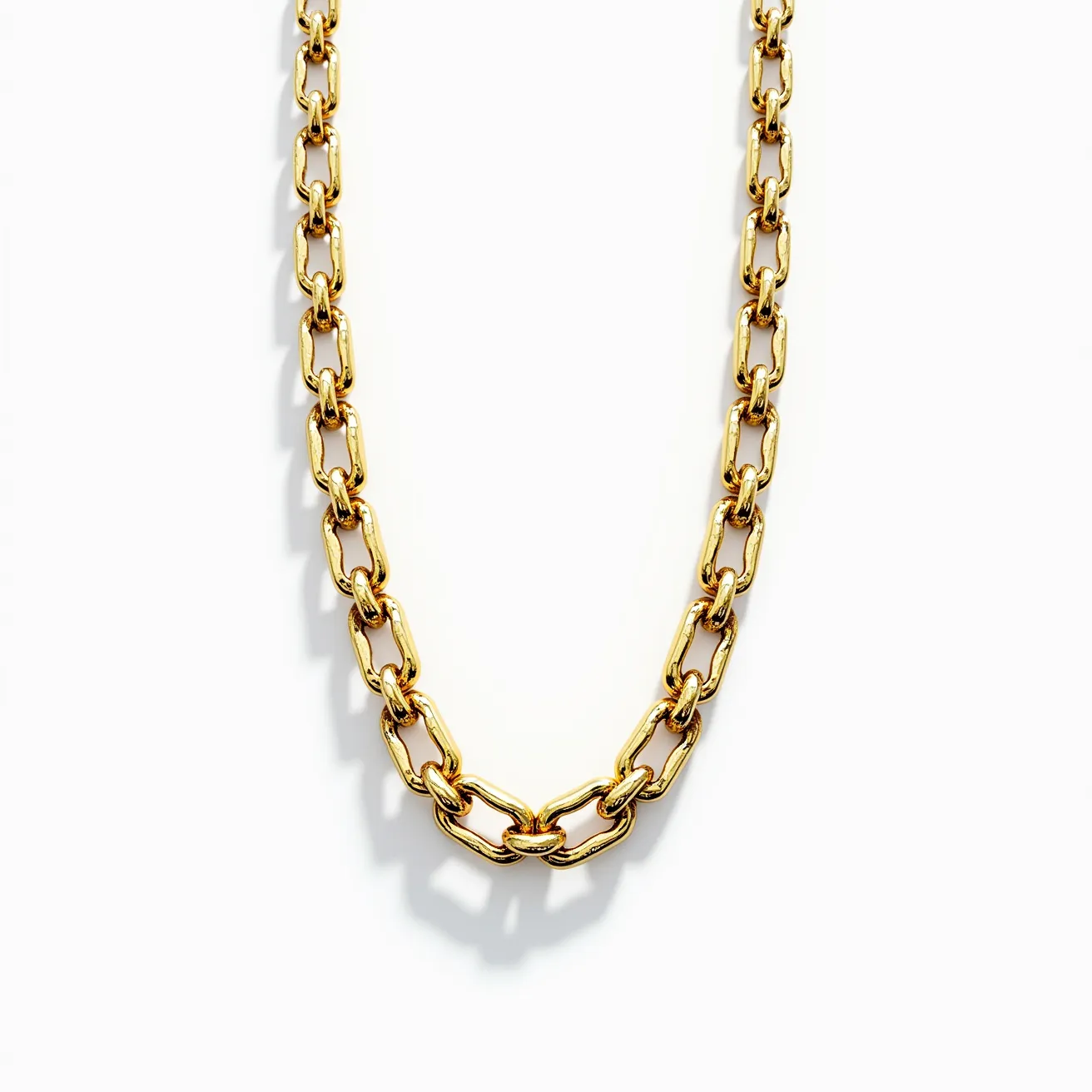 This link necklace is crafted from a lustrous material that appears to be gold, featuring interlocking oval links arranged in a classic chain design. The links are polished, contributing to the necklace's smooth and reflective finish. There are no visible gems or stones integrated into the design, focusing instead on the intricate detailing of each link. The necklace is likely secured by a clasp that blends seamlessly with the overall style, though it is not distinctly visible. The overall appearance suggests a versatile piece suitable for both casual and formal occasions.