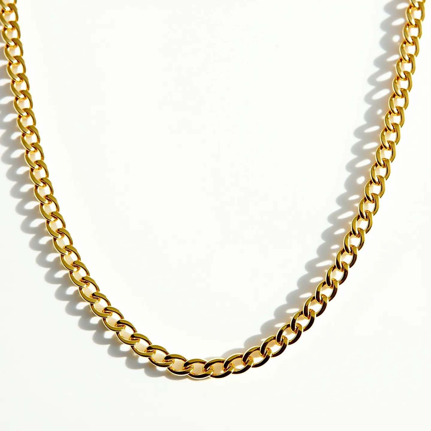 This link necklace features a classic design with interlocking, oval-shaped links that are smooth and polished, creating a sleek and elegant appearance. It appears to be crafted from a gold-toned metal, giving it a warm and luxurious shine. The links are uniform in size, contributing to the necklace's balanced and symmetrical look. Although there are no visible gems or stones set within the design, the simplicity of the necklace allows for a versatile and timeless aesthetic. The necklace likely includes a standard closure mechanism, such as a lobster clasp or spring ring, ensuring secure and easy wearability.