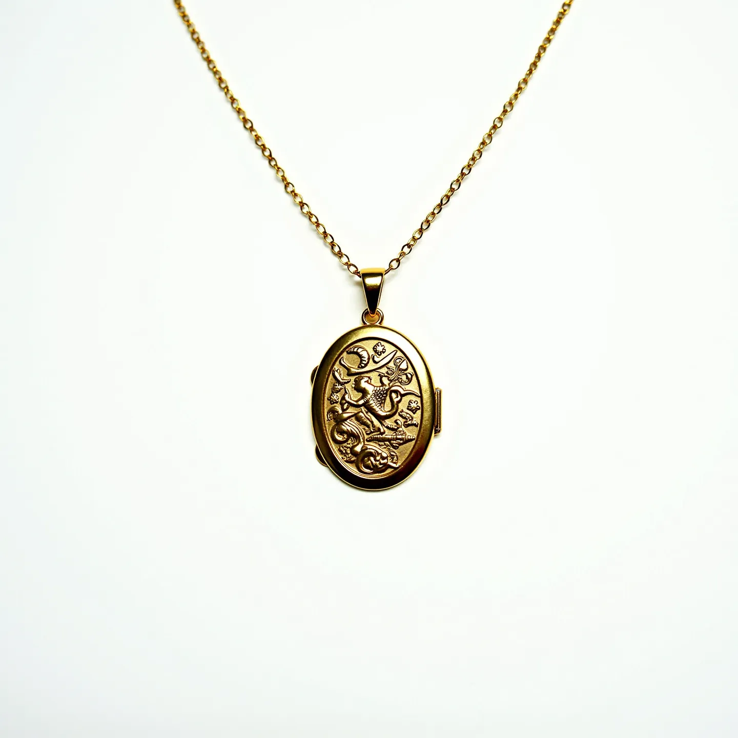 This locket necklace features an oval-shaped pendant crafted from gold, showcasing an intricate embossed design that gives it a sophisticated and classic appeal. The pendant hangs from a delicate, gold chain composed of small, uniformly sized links that provide both strength and elegance. The absence of visible gems or stones suggests the focus is on the intricate metalwork of the locket. The locket appears to have a hinge on the side, indicating its functional nature to open and hold small keepsakes or photos. It is suspended from the chain by a simple bail, which ensures smooth movement along the chain and adds to the necklace's overall minimalist design.