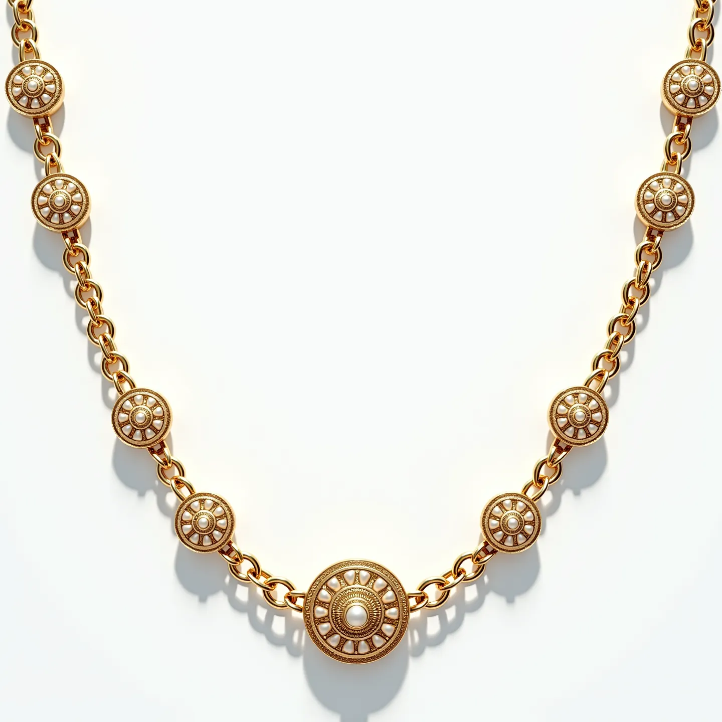 This long gold necklace features a series of round, ornate medallions set along a chain. Each medallion is crafted from gold and adorned with a central pearl, surrounded by intricate cut-out patterns that enhance its elegance. The pearls are cabochon set, adding a smooth and lustrous finish to the design. The chain links are substantial, providing sturdy connections between each decorative element. The necklace is likely secured with a traditional clasp, ensuring both security and style for the wearer.