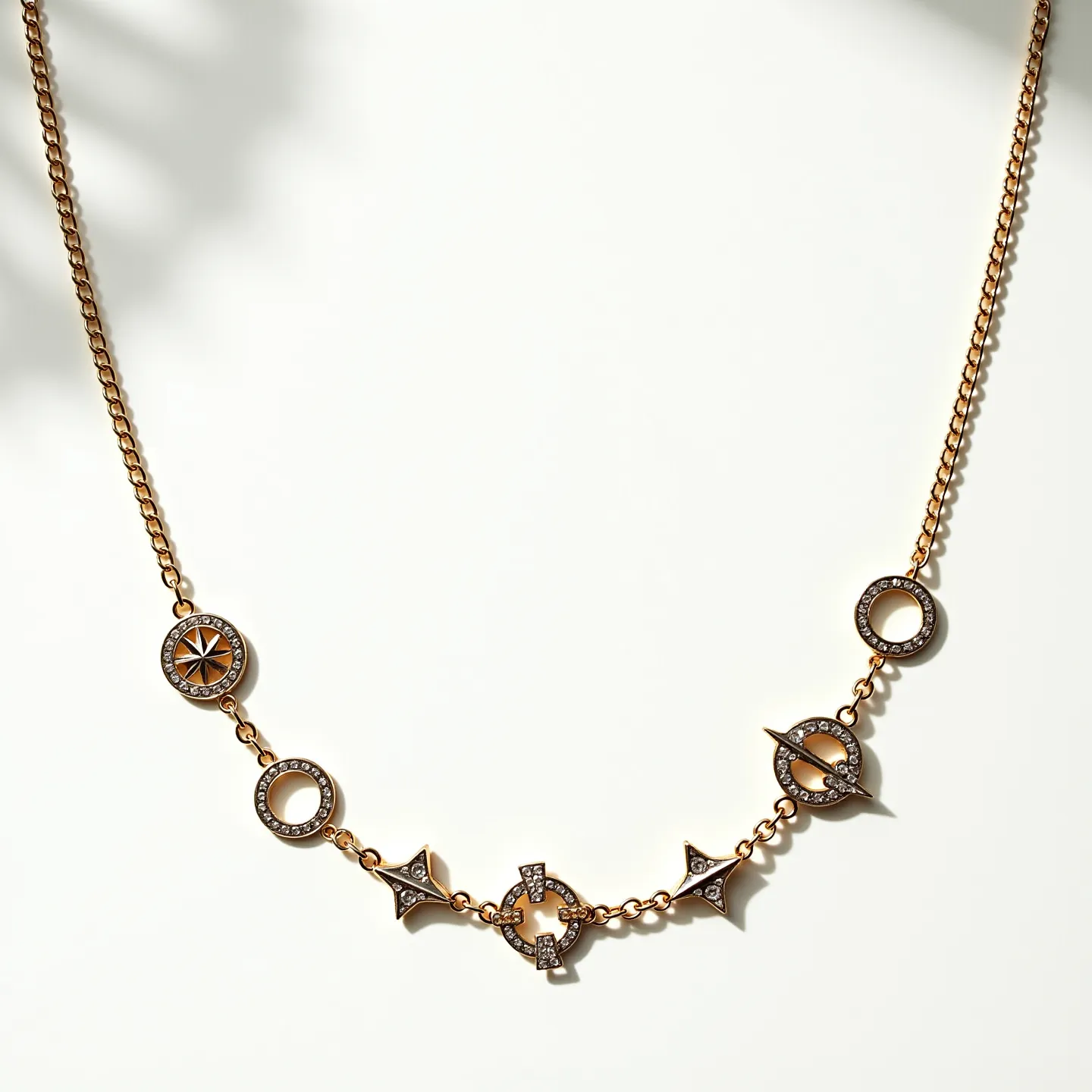 This long gold necklace features a combination of intricately designed elements and a rich, warm sheen. The chain is adorned with a series of distinctive geometric and circular pendants, each embellished with sparkling stones, likely diamonds, set in pavé settings. The stones add a luxurious shimmer to the necklace, complementing its gold structure. The circular motifs are detailed, with one depicting a star design at its center, enhancing the necklace's elegance. The combination of shapes and carefully placed stones create an aesthetic balance, making it versatile for different occasions. The necklace does not show a clasp in the visible section but is designed for a seamless appearance.