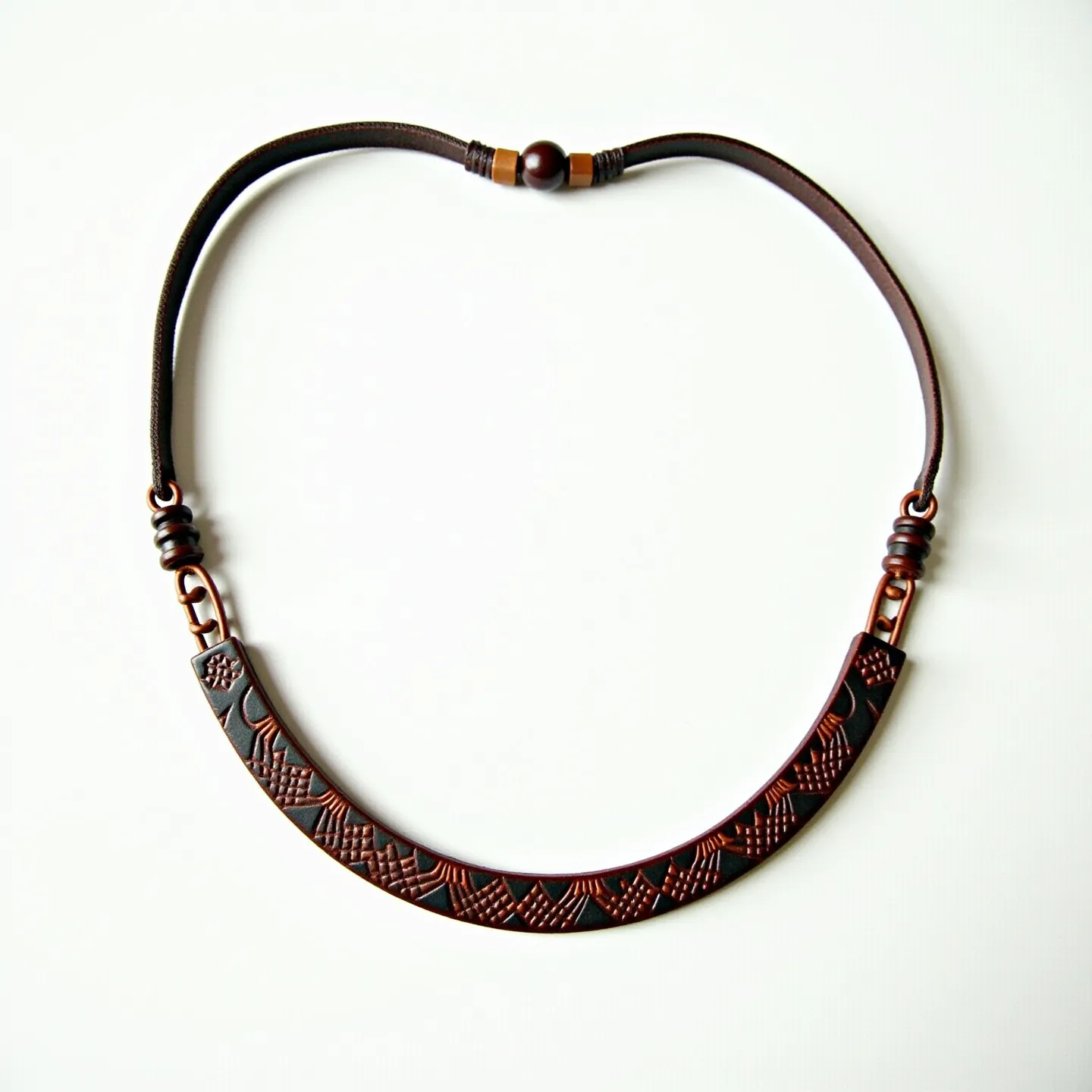 This men's necklace features a distinctly crafted design with a dark, matte finish. The main section is made from a textured, curved metal bar with an intricate pattern that adds a unique aesthetic. The bar connects to a brown cord, likely leather or a similar material, which complements the earthy tones of the necklace. The attachment is secured with metallic rings that provide both stability and a cohesive design element, seamlessly blending functionality with style. At the center, a round bead serves as a highlight, acting as a focal point and adding visual interest without overpowering the overall balanced look.