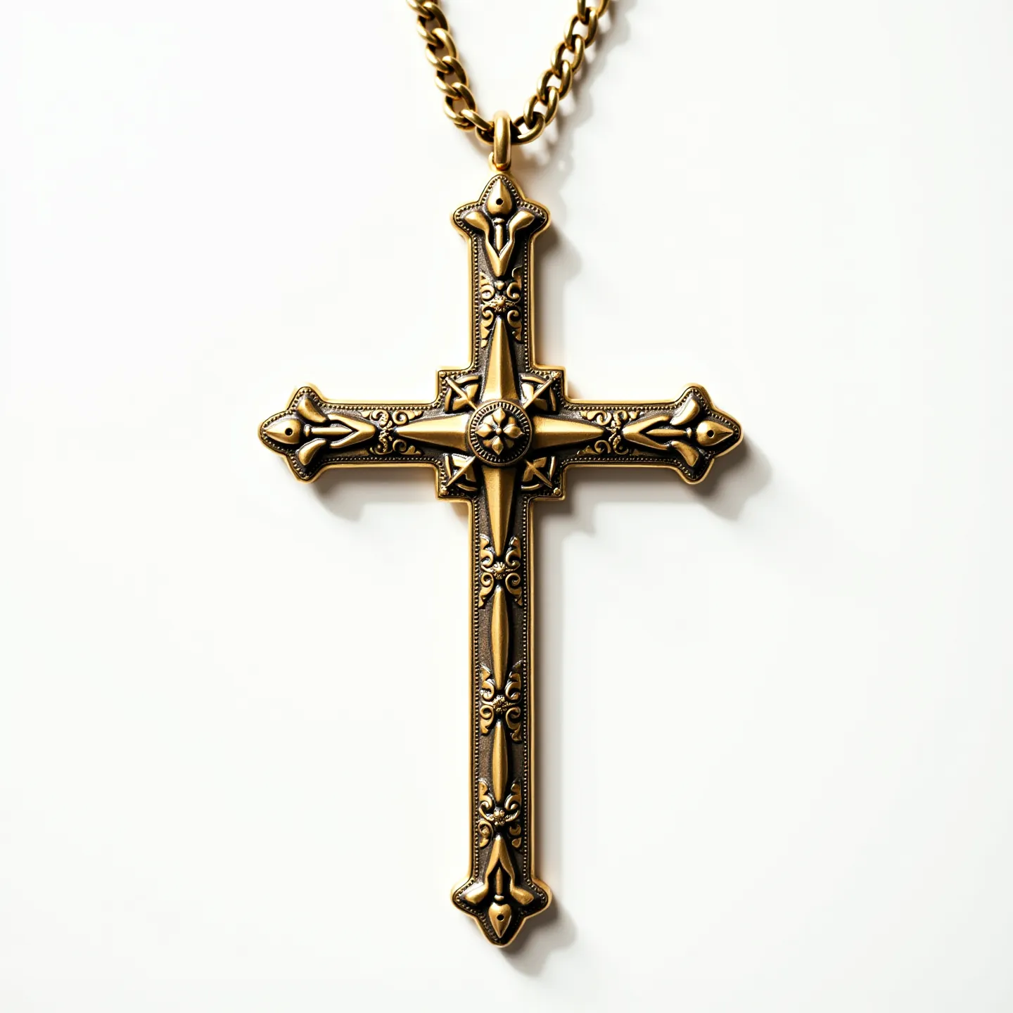 This nail cross necklace features a design that appears to be crafted from a metallic material with an antiqued brass or bronze finish, giving it a classic and aged look. The cross is adorned with intricate patterns and details, enhancing its visual appeal. At the center, there is a circular decor that resembles a gem or stone set with a star-like emblem, though it is part of the metalwork rather than an actual stone. The necklace includes a thick chain, likely made from a matching metal material, with a standard lobster clasp for secure attachment.