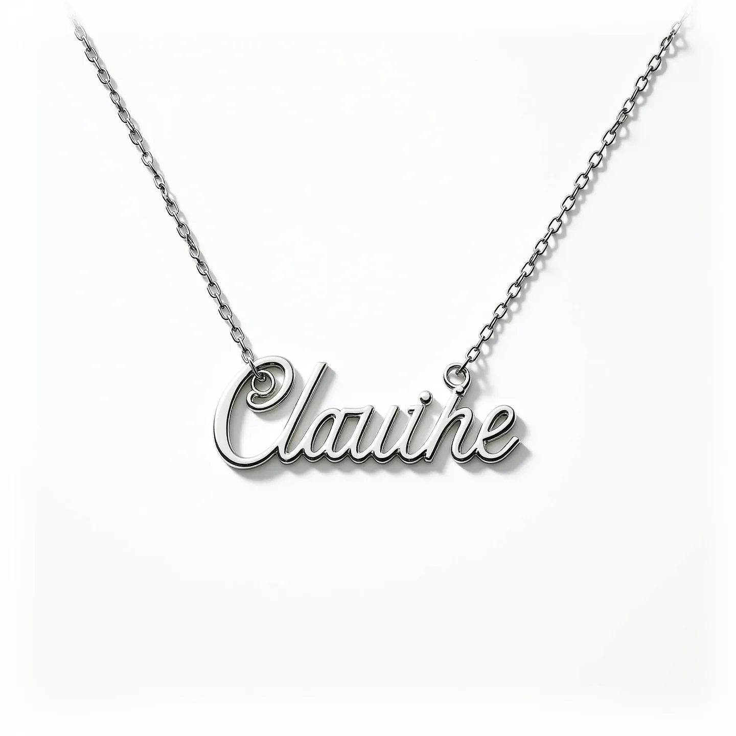 This name chain necklace features a sleek metal design with the name "Clauihe" elegantly crafted in a cursive script. The material appears to be polished metal, possibly silver or stainless steel, giving it a shiny and smooth finish. The chain is a delicate link style that seamlessly integrates with the nameplate, appearing to be connected at either end of the name for a balanced look. There are no visible gemstones or extra embellishments on the nameplate. The necklace likely includes a simple clasp mechanism, such as a lobster or spring ring clasp, providing a secure and practical closure.