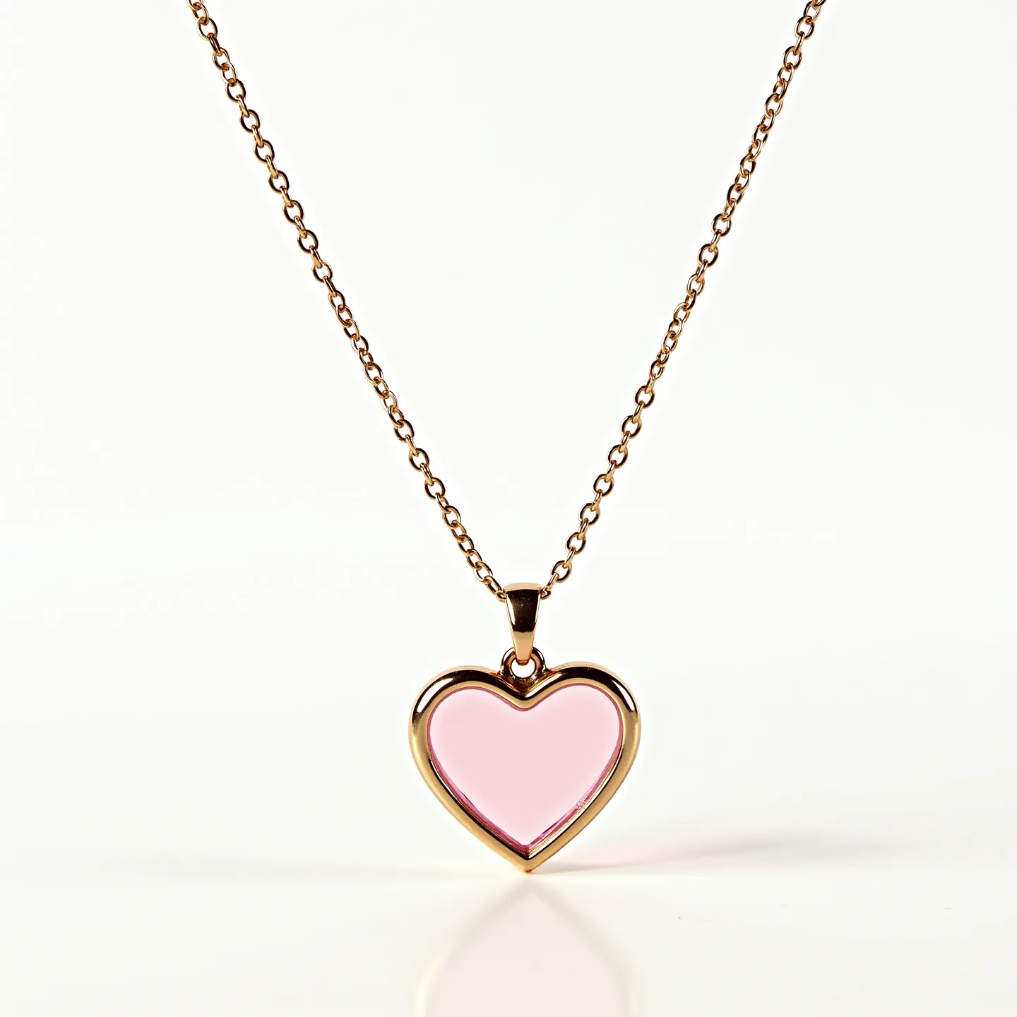 This pink heart necklace features a delicate chain made of a metal with a gold-toned finish. The pendant is a heart-shaped piece crafted from a pink-hued material, likely a polished stone or glass, set in a sleek metal frame that matches the chain. The heart pendant is secured with a simple and elegant bezel setting, ensuring its focus as the centerpiece. The necklace includes a standard clasp, offering ease of wear while complementing the overall design. The minimalistic yet graceful style of this necklace makes it a versatile accessory for various occasions.