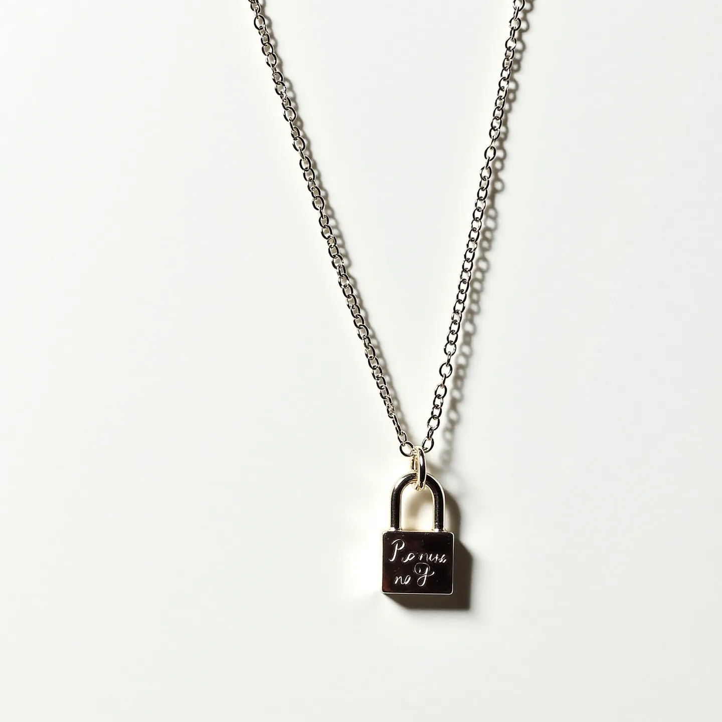 This promise necklace features a delicate metal chain, likely made of silver or stainless steel, lending a sleek and modern look to the piece. At the center is a small padlock pendant, engraved with the word "Promise" in an elegant script, adding a romantic and symbolic touch. The lock is attached to the chain with a polished metal loop, ensuring secure placement. The overall design is minimalist and understated, making it versatile for everyday wear.