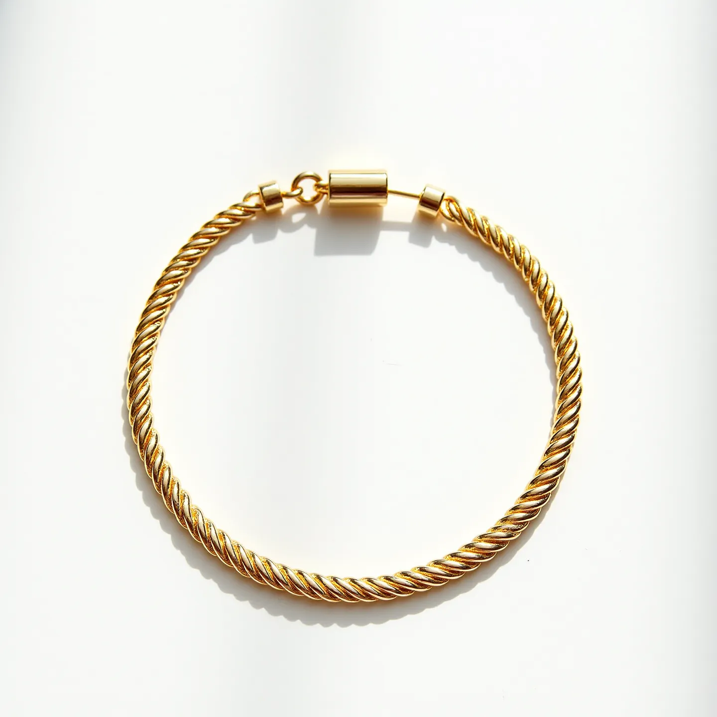 This rope chain is crafted from gold, featuring a classic twisted design that adds texture and visual depth. The chain is completed with a cylindrical clasp, providing a secure and seamless closure. The overall appearance is elegant and timeless, making it suitable for both everyday wear and special occasions. The absence of gems keeps the design simple and focused on the intricate rope detailing.