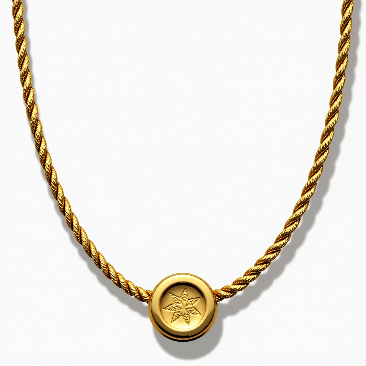 This rope chain features a twisted design and is crafted from a material with a gold hue, suggesting the use of gold or a gold-toned metal. At the center, there is a circular pendant embossed with a star-like pattern, adding a decorative element to the piece. The pendant appears to be seamlessly integrated into the chain, offering a cohesive look. The chain terminates with a clasp, likely a lobster or spring ring type, ensuring secure wearability. The overall design is elegant and classic, suitable for various occasions.