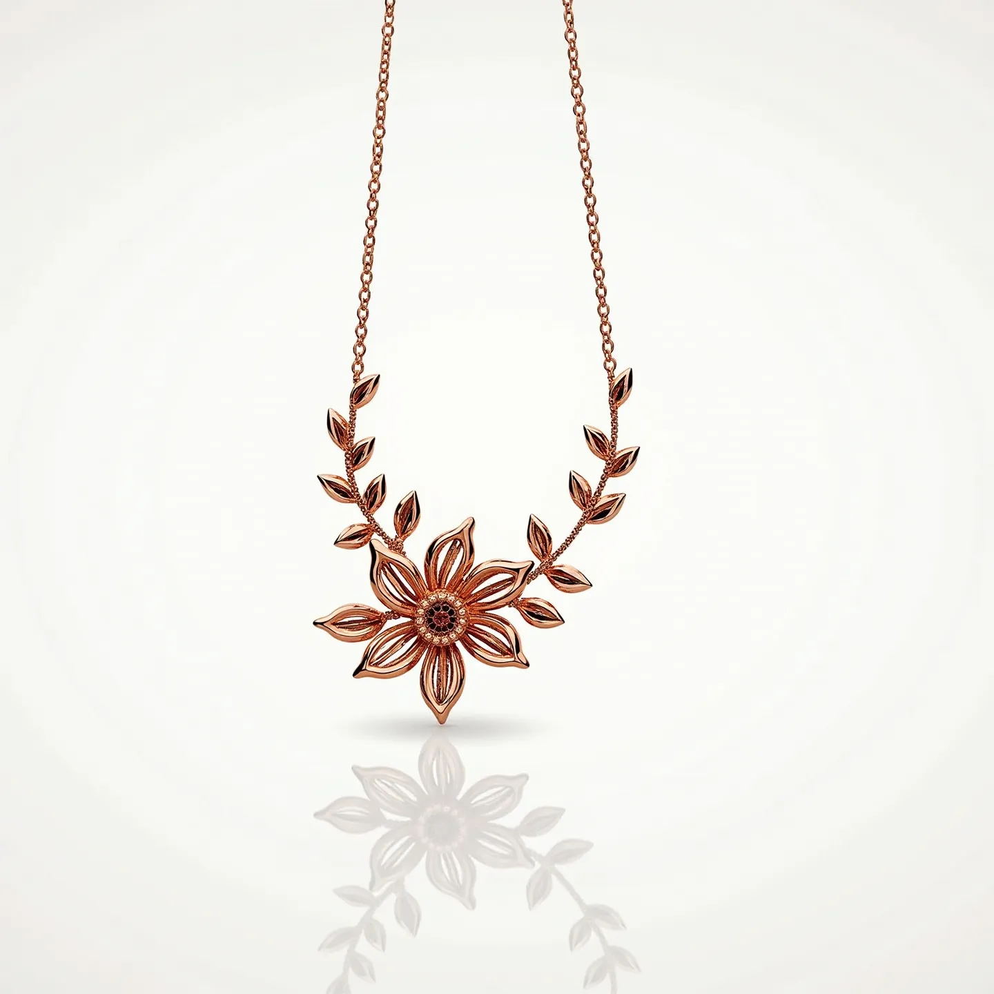 This rose gold necklace features an elegant floral design with a central flower and delicate leaves extending along the chain. The intricate flower pattern is crafted from rose gold, highlighting the warmth and subtle shine of the metal. The petals are finely detailed, and though not embellished with additional gemstones, the design itself exudes a refined beauty. The leaves are uniformly spaced, adding to the necklace’s harmonious aesthetic. The chain appears to be of a simple link style, providing a sturdy yet graceful attachment to the floral centerpiece. The necklace likely closes with a clasp typical of such jewelry pieces, ensuring a secure fit when worn.