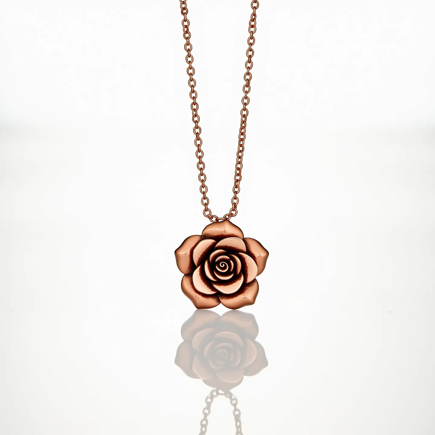 This rose necklace features a beautifully crafted rose pendant, likely made of a rose gold-toned metal, giving it an elegant and warm appearance. The pendant is suspended from a matching delicate chain, which adds to its overall refined look. The chain consists of small, evenly spaced links that provide a seamless and continuous visual flow. The necklace is completed with a lobster clasp, ensuring secure and easy fastening.