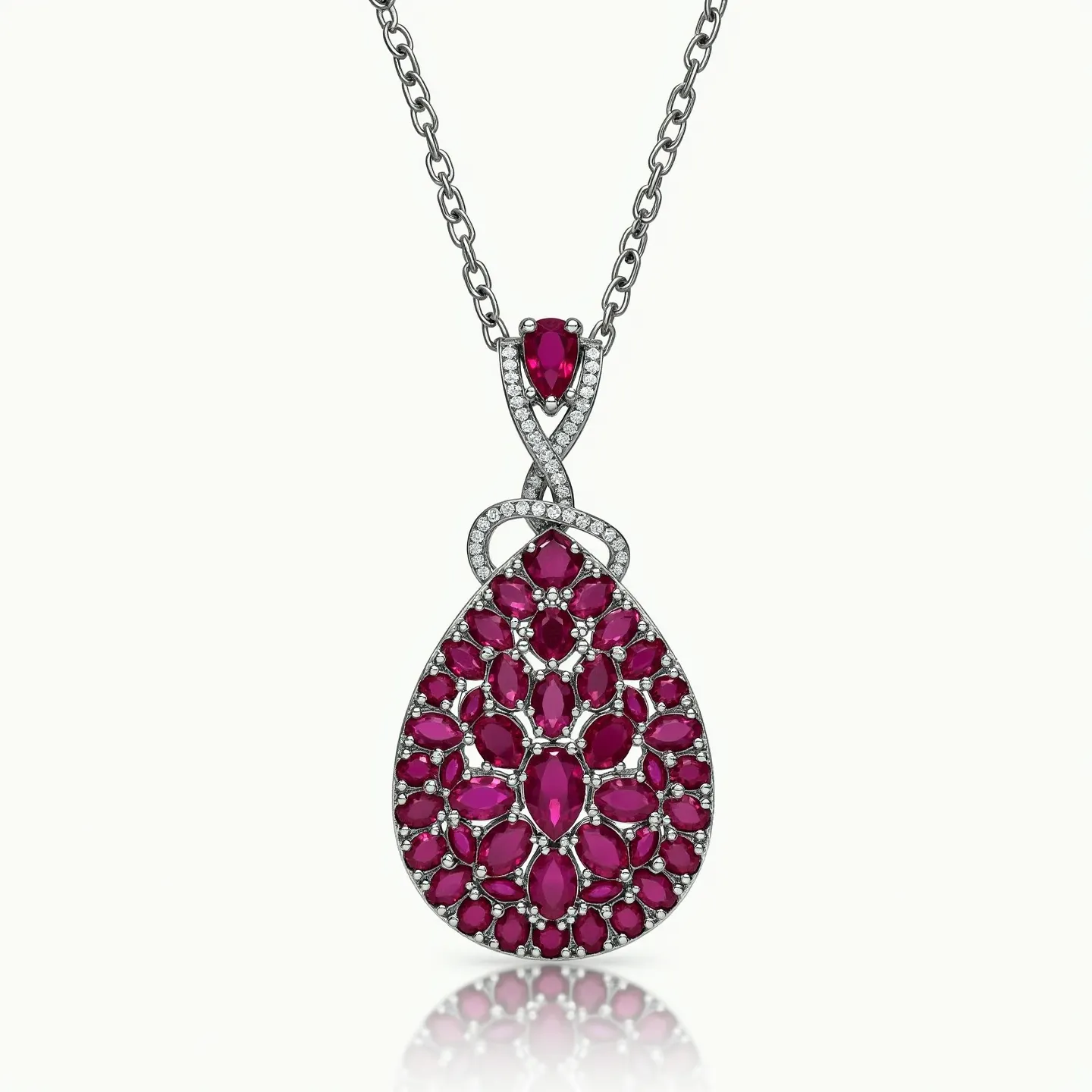 This ruby necklace features an intricate teardrop-shaped pendant composed of numerous oval and marquise-cut rubies, beautifully arranged in a lattice pattern. Each ruby is held in place by prong settings that allow light to reflect brilliantly off the gemstones. Surrounding the central ruby design is a delicate halo of smaller, round diamonds, adding a subtle sparkle and enhancing the necklace's luxurious appeal. The pendant is attached to a sturdy metal chain by a single pear-shaped ruby in a similar diamond halo setting, forming an elegant loop design. The necklace likely includes a secure clasp, typical of such sophisticated pieces, ensuring both functionality and elegance.