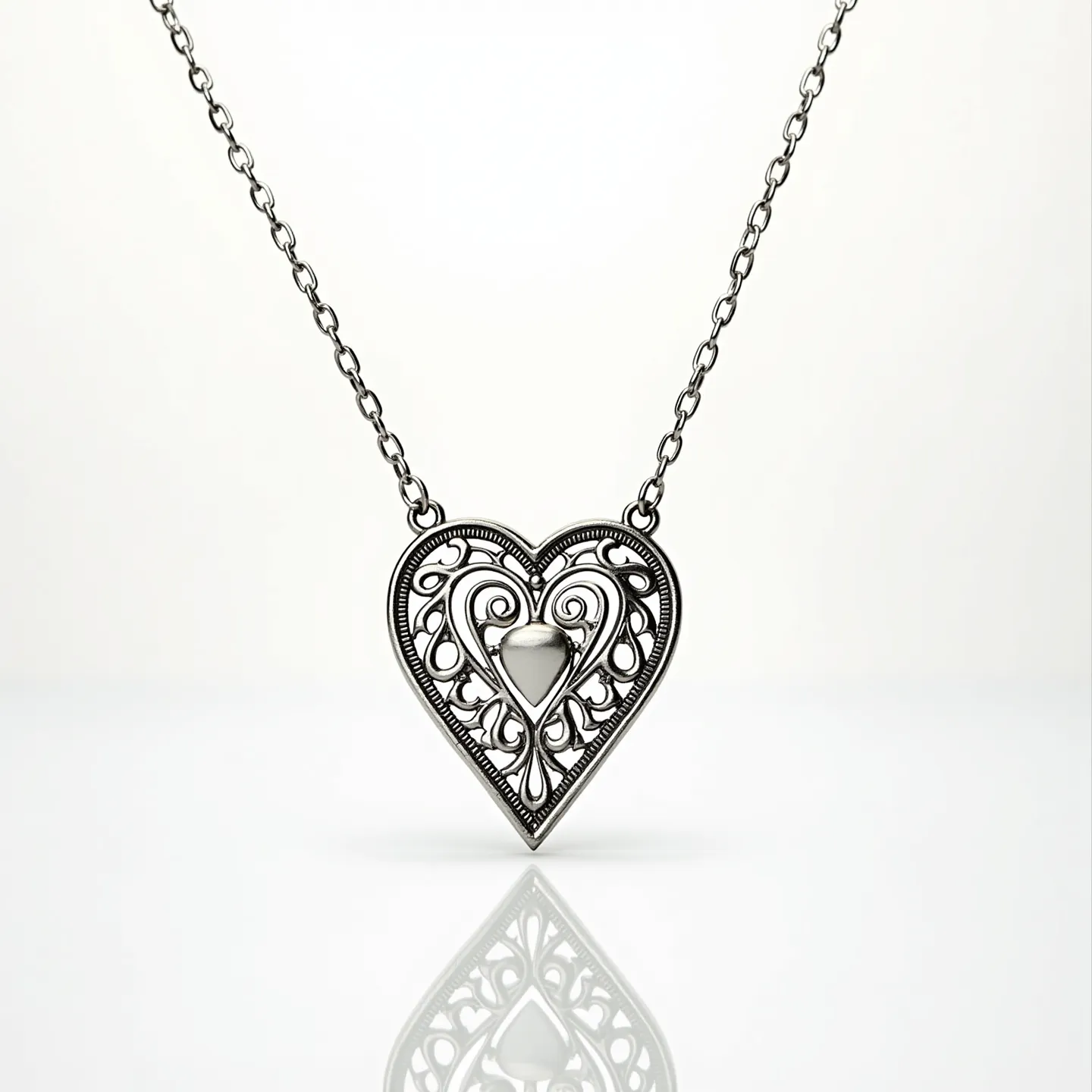 This sacred heart necklace features a beautifully crafted heart-shaped pendant with intricate filigree detailing, likely made from a silver-toned metal. The central element of the heart is a smooth, polished metal piece, adding a striking focal point to the design. The pendant is symmetrically attached to a delicate chain with evenly spaced links, contributing to its elegant aesthetic. The necklace is completed with a standard clasp mechanism that allows for secure fastening and ease of wear, complementing the overall refined appearance of the piece.