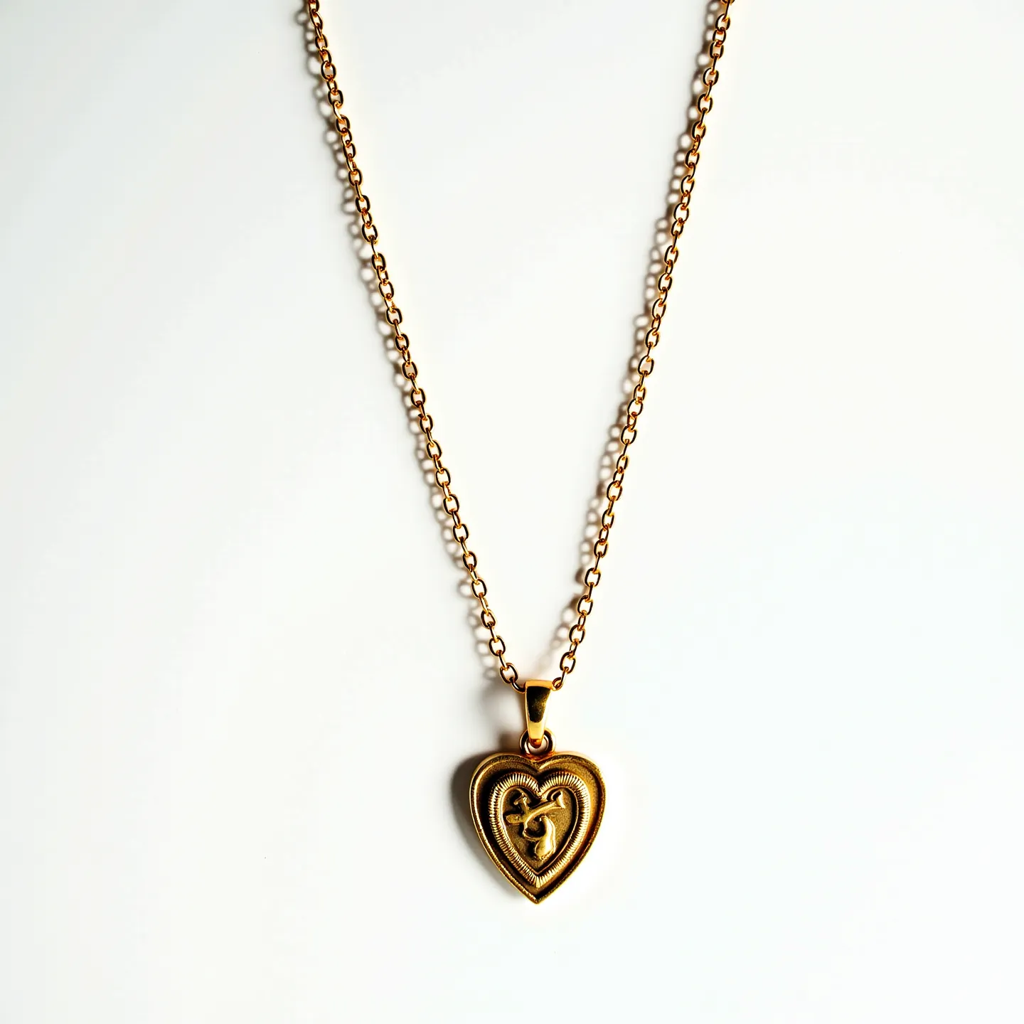 This sacred heart necklace features a beautifully crafted heart-shaped pendant made from a gold-toned metal, exuding a classic and timeless elegance. The pendant showcases a detailed design with an encompassing raised heart motif, adding depth and interest. Attached to a delicate chain, the necklace secures with a traditional lobster clasp, ensuring both functionality and style. The overall design reflects a sense of devotion and grace, making it an ideal piece for both everyday wear and special occasions.