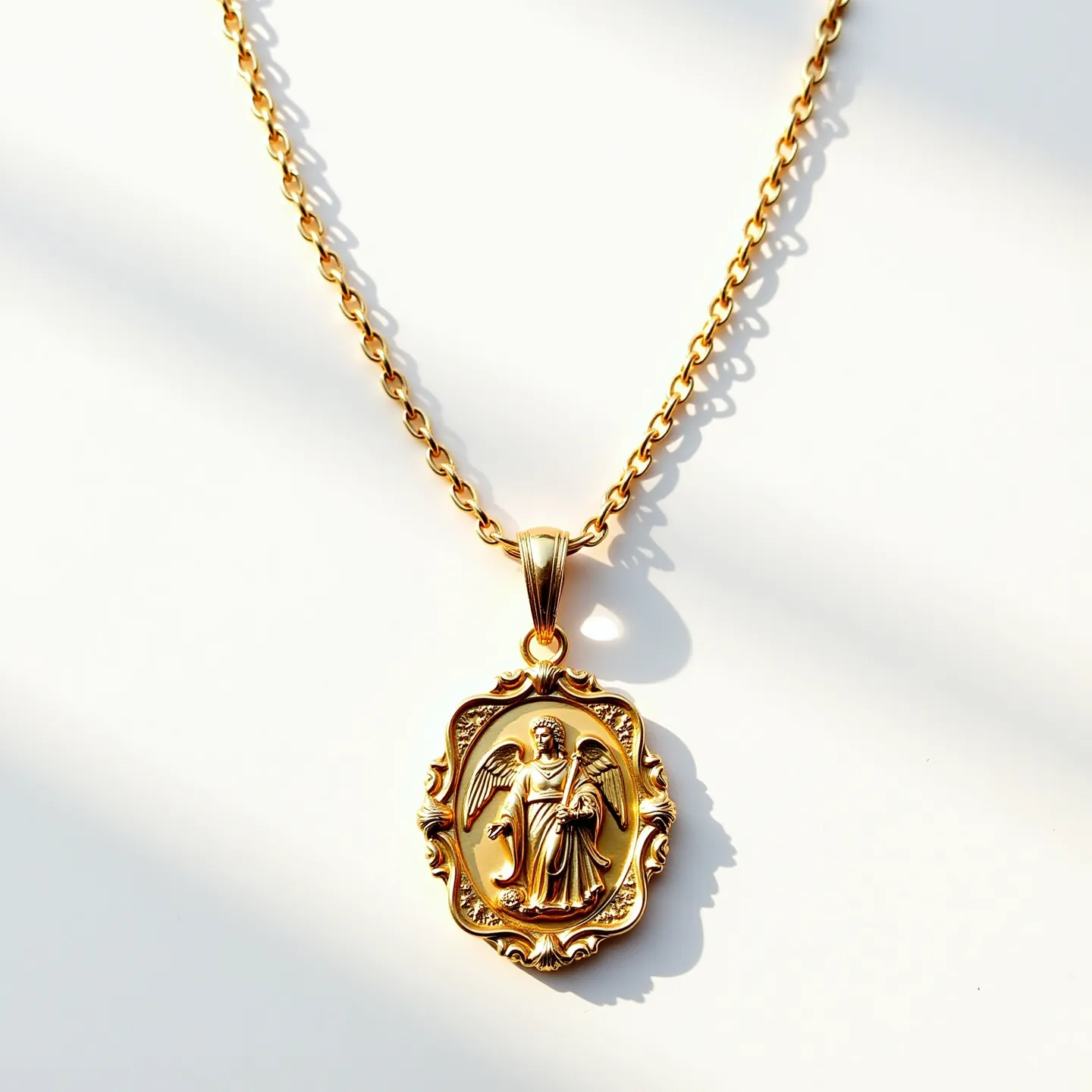 This Saint Michael necklace features a beautifully detailed gold-toned pendant, capturing the archangel in a striking and protective pose. The pendant is crafted from a lustrous metal and has an ornate frame with intricate scrollwork. The chain is composed of uniform, rounded links that complement the pendant’s elegant appearance. The necklace is devoid of any gemstones, focusing instead on the craftsmanship of the metalwork. It is likely secured with a classic clasp that ensures both functionality and aesthetic continuity with the overall design.