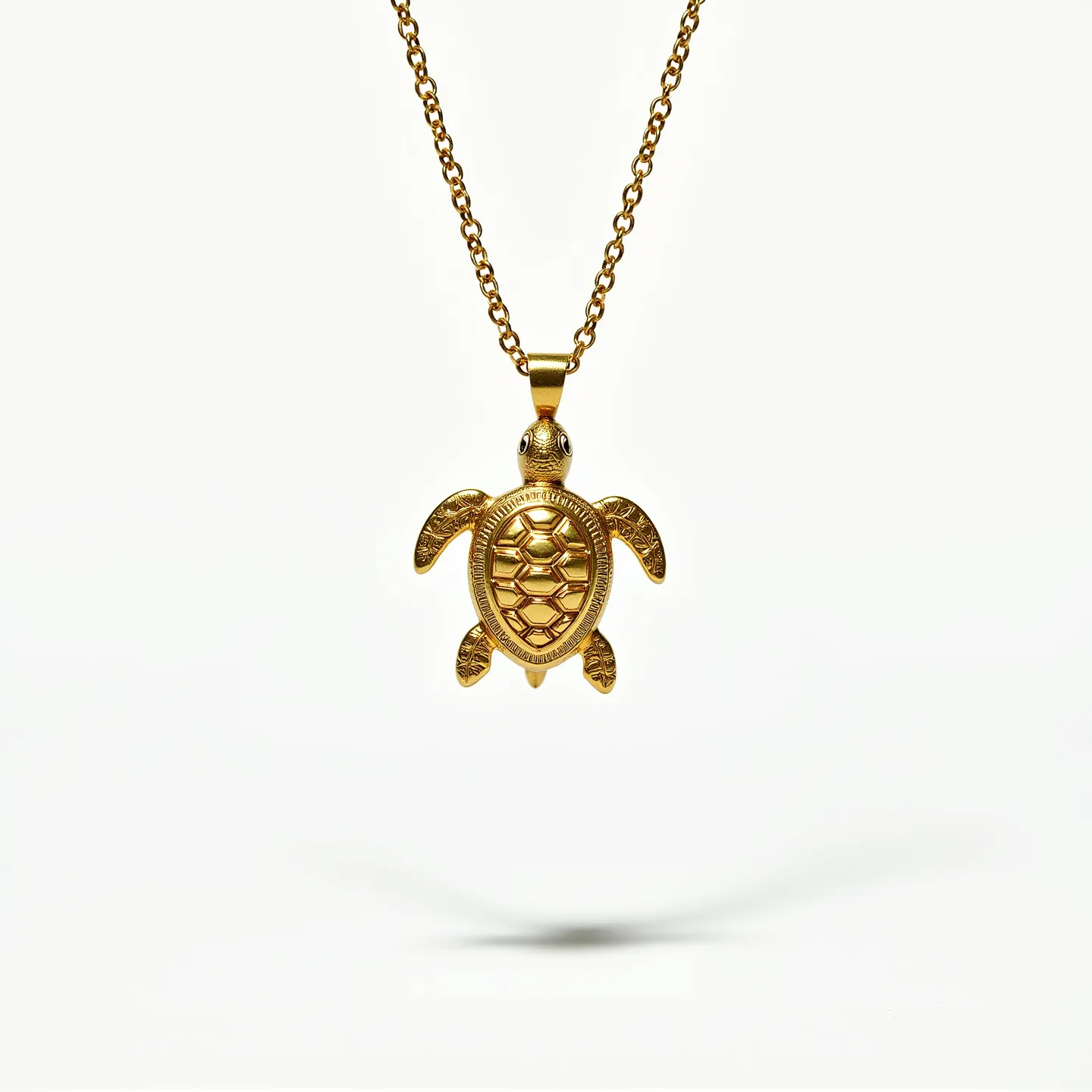 This sea turtle necklace features a detailed pendant crafted in a golden-hued metal, showcasing intricate patterns on the turtle's shell and flippers. The pendant hangs from a chain that appears to be made of similar gold-toned metal, with a polished, interlocking link design. The turtle's eyes and shell detail are finely engraved, reflecting light and adding depth to the piece. The pendant is likely attached to the chain via a small bail, ensuring secure movement. The chain is finished with a standard clasp, designed for easy fastening and wearability.