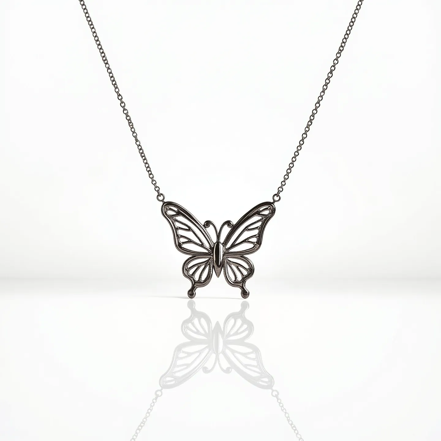 This silver butterfly necklace features a delicately crafted butterfly pendant made from polished silver, ensuring a lustrous finish that catches the light beautifully. The openwork design of the butterfly lends an airy, lightweight feel while maintaining a solid structure. The pendant is centered on a silver chain, enhancing its elegance with a classic, versatile look. There are no additional gems or stones embellishing the piece, giving it a pure and sophisticated appearance. The necklace is completed with a standard clasp for secure wear, blending seamlessly with the overall design for ease of use.