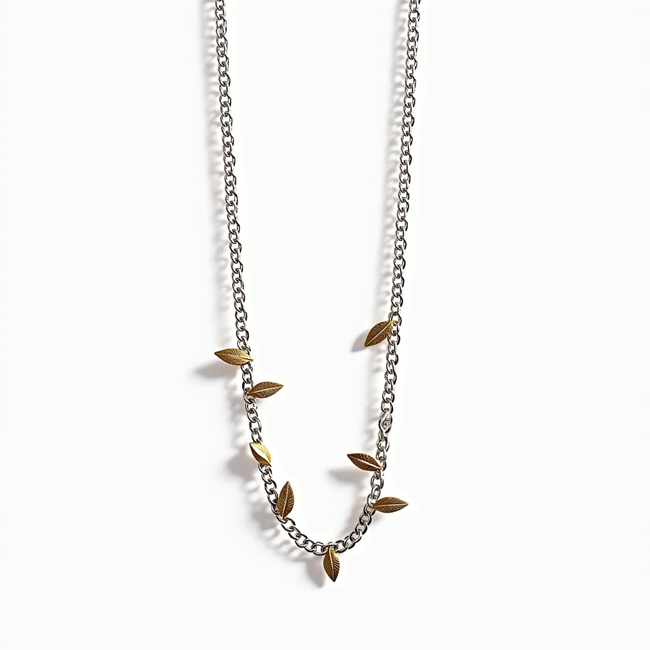 This silver chain features an attractive arrangement of gold-colored leaf charms elegantly spaced along its length, adding a touch of nature-inspired design. The chain appears to be made from high-quality silver, providing a sleek, shiny finish that complements the warm tone of the leaves. Each leaf is intricately detailed, enhancing the overall aesthetic with texture and sophistication. The chain is likely secured with a standard clasp, ensuring easy wearability and secure attachment. The combination of metallic tones creates a versatile piece that can be paired with various styles.