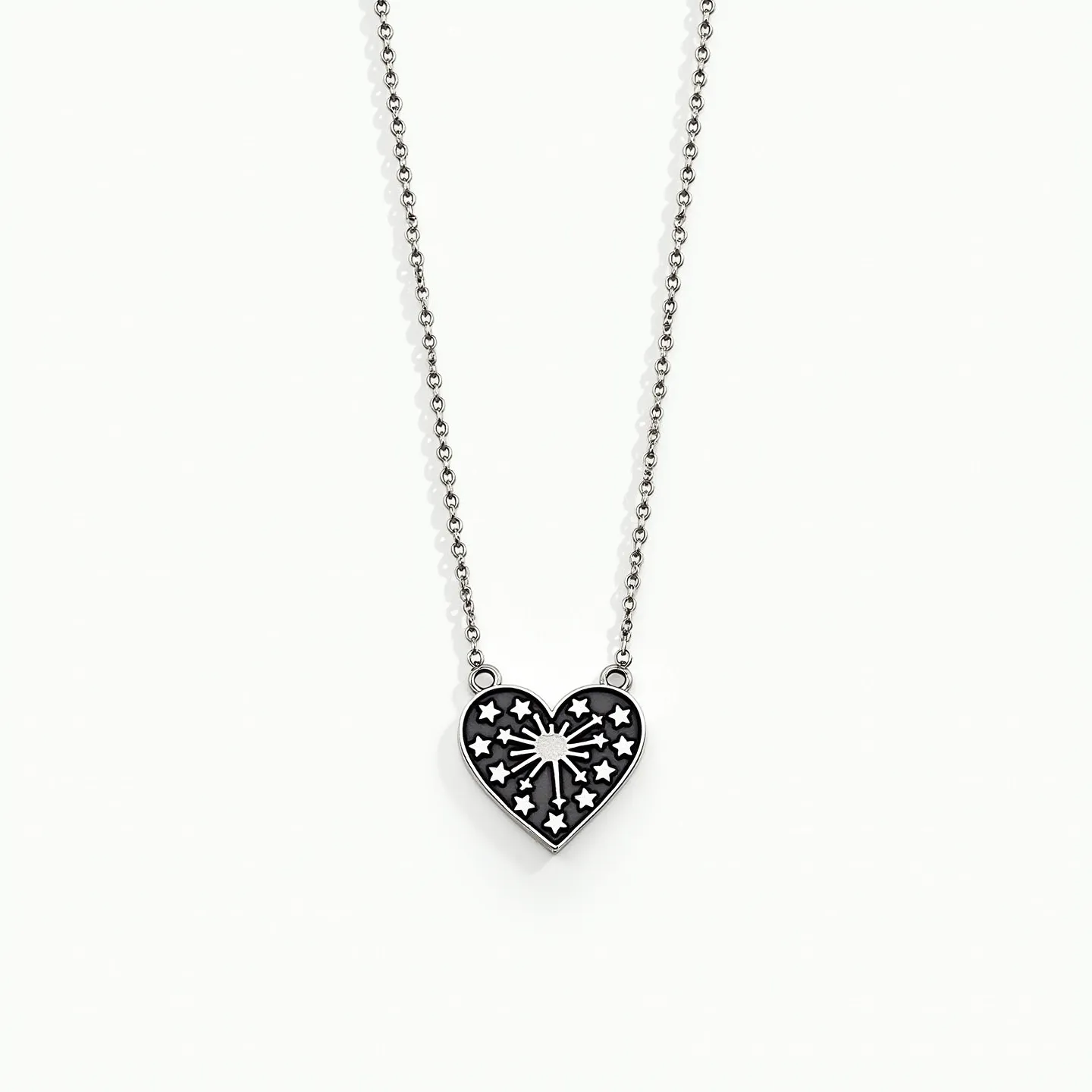 This silver heart necklace features a sterling silver heart-shaped pendant adorned with engraved symbols resembling stars, around a central burst pattern. The heart pendant is connected to a delicate silver chain, contributing to its elegant design. The pendant's intricate design highlights the craftsmanship, giving it a unique and artistic flair. The chain appears to be equipped with a simple clasp, which ensures the necklace is easy to fasten and secure while wearing. The overall structure of the necklace emphasizes its delicate and charming aesthetic.