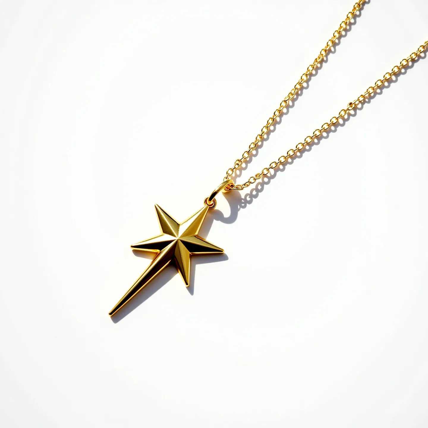 This star necklace features a sleek and polished gold-toned metal crafting the star-shaped pendant, which hangs elegantly from a delicate gold-toned chain. The star pendant boasts a modern, angular design, adding a contemporary flair to its overall appearance. The chain features a simple yet functional round-link style, allowing for comfortable wear. The necklace is equipped with a lobster clasp, providing secure fastening and ease of use. There are no visible gems or additional embellishments on this minimalist piece, highlighting its clean and stylish form.