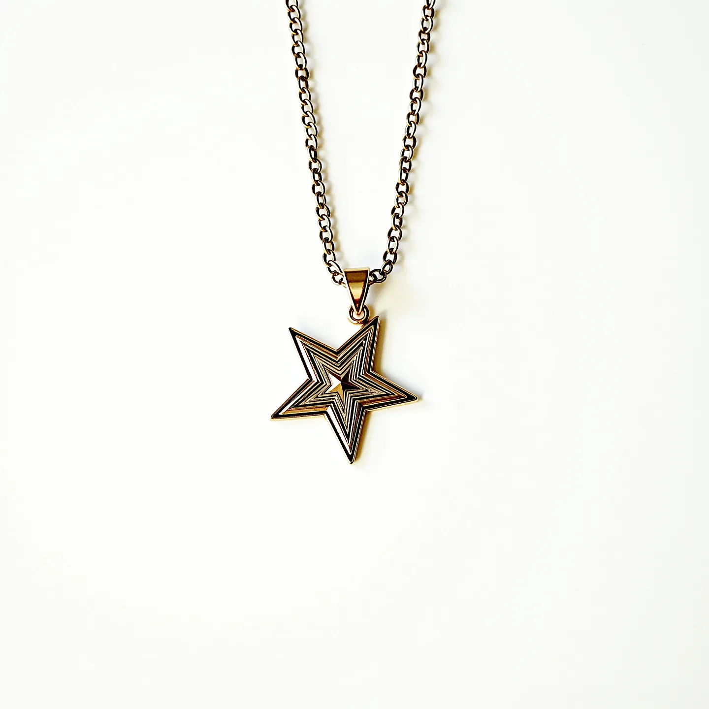 This star necklace features a striking star-shaped pendant with an intricate, layered design, possibly made from metal with a polished finish. The star is suspended from a chain, likely crafted from the same metal, providing a cohesive aesthetic. The pendant is attached to the chain via a simple yet elegant triangular bail, designed to securely hold the pendant in place. The chain displays a classic link design, lending both durability and style to the piece. There are no visible gemstones, which allows the detailed star motif to remain the focal point of the necklace.