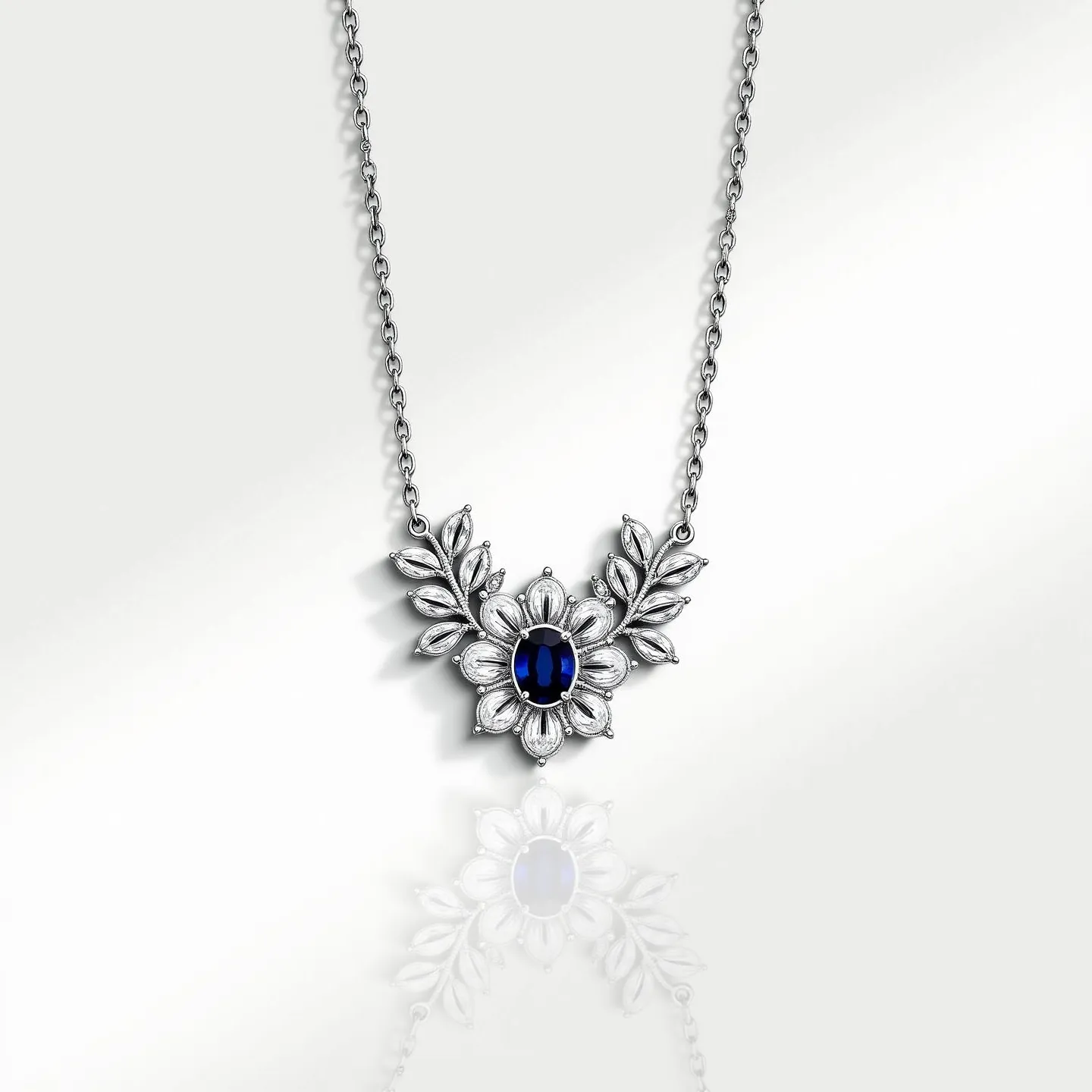 This stone necklace features an intricately designed floral pendant set on a delicate silver chain. The centerpiece is a prominent, oval-shaped blue gemstone, likely a sapphire, cut to enhance its deep color and clarity. The stone is secured in a prong setting, framed by a floral motif with petal-like silver embellishments that add elegance to the overall design. Each petal has subtle texturing, enhancing the necklace's sophistication. The chain appears to use a classic cable link, providing durability while maintaining a refined appearance, and it is likely fastened with a typical spring ring clasp for secure attachment.