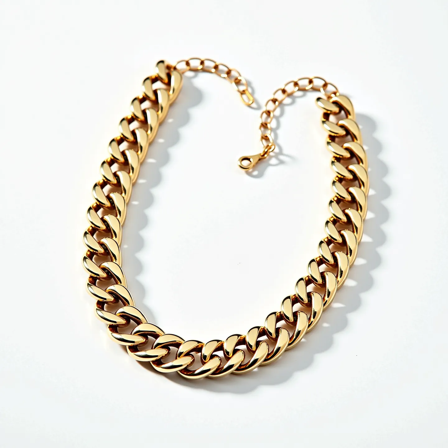 This thick chain necklace is composed of large, interlocking links that have a polished gold-tone finish, exuding a bold and modern aesthetic. The links are uniformly sized, contributing to its substantial appearance. It features a lobster clasp for secure fastening, accompanied by an adjustable extender chain, allowing for customizable length. The design is sleek and streamlined, without any additional embellishments such as gemstones or engravings, highlighting the elegance and simplicity of the piece.