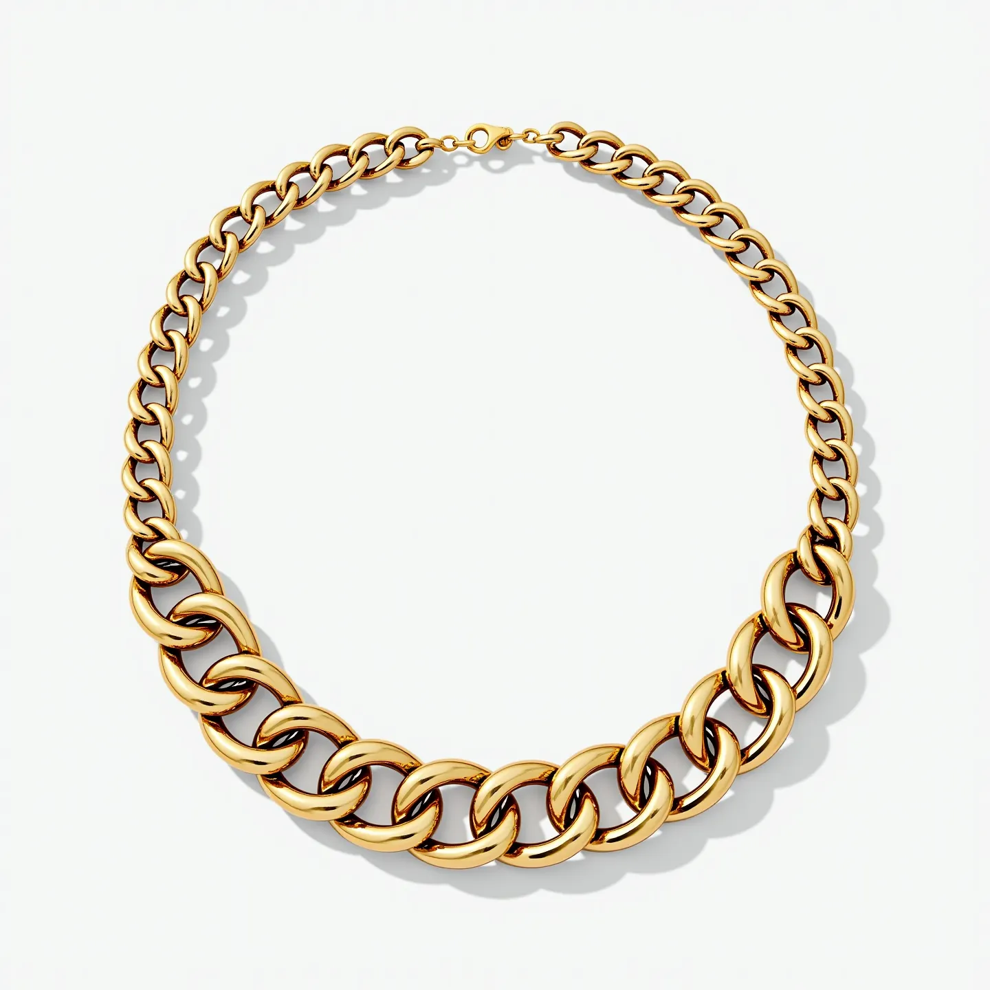 This thick chain necklace features elegantly large links crafted from a shiny gold-toned metal, creating a bold and stylish statement piece. The links are uniformly oval-shaped with a polished finish that enhances the reflective quality of the metal. The necklace is completed with a simple lobster clasp, ensuring a secure and adjustable fit. The design is sleek and contemporary, with an emphasis on the luxurious and solid appearance provided by the thickness and weight of the metal used.