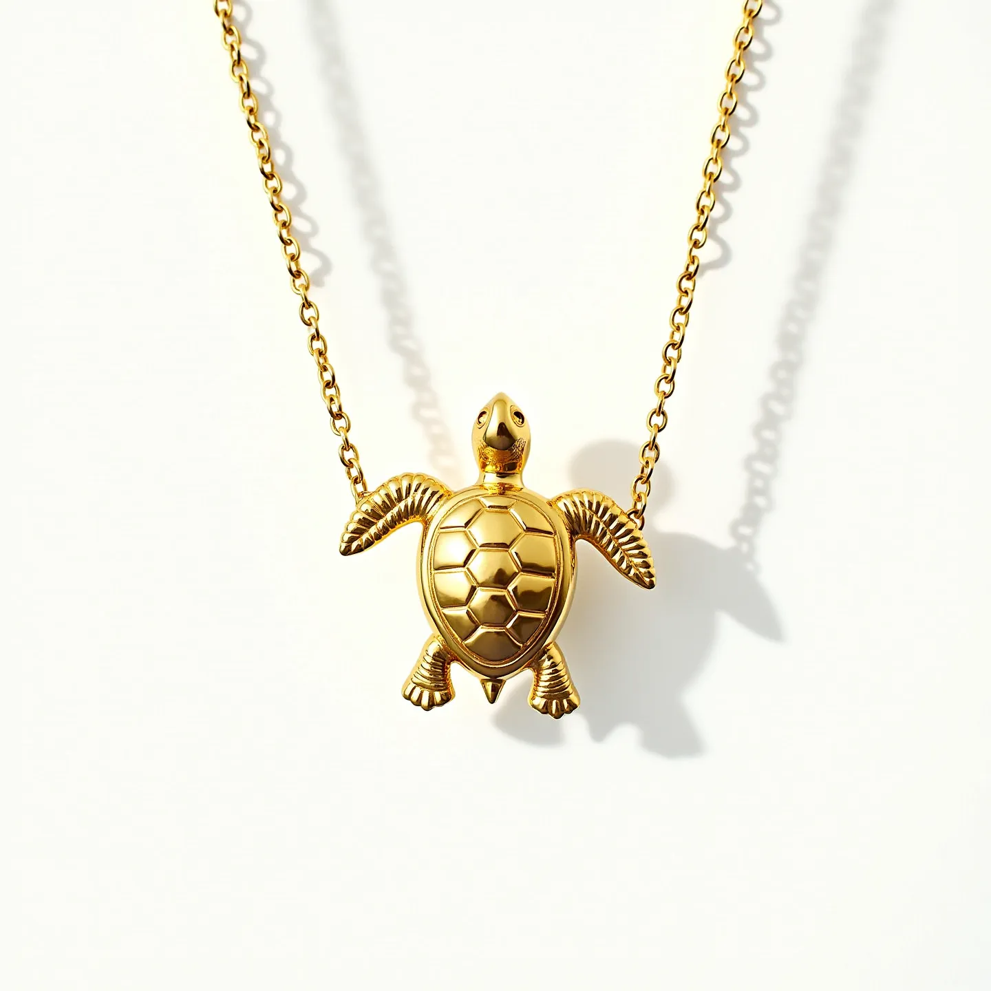 This turtle necklace is crafted from gold-toned metal, featuring a pendant shaped like a turtle. The turtle's shell is highly polished and depicts a pattern of hexagonal segments. The pendant is attached to a chain, which is comprised of small, uniform links giving it a delicate and elegant appearance. The necklace does not display any visible stones or gems, maintaining a clean and simple aesthetic. It has a small, secure clasp to ensure easy wear and removal.