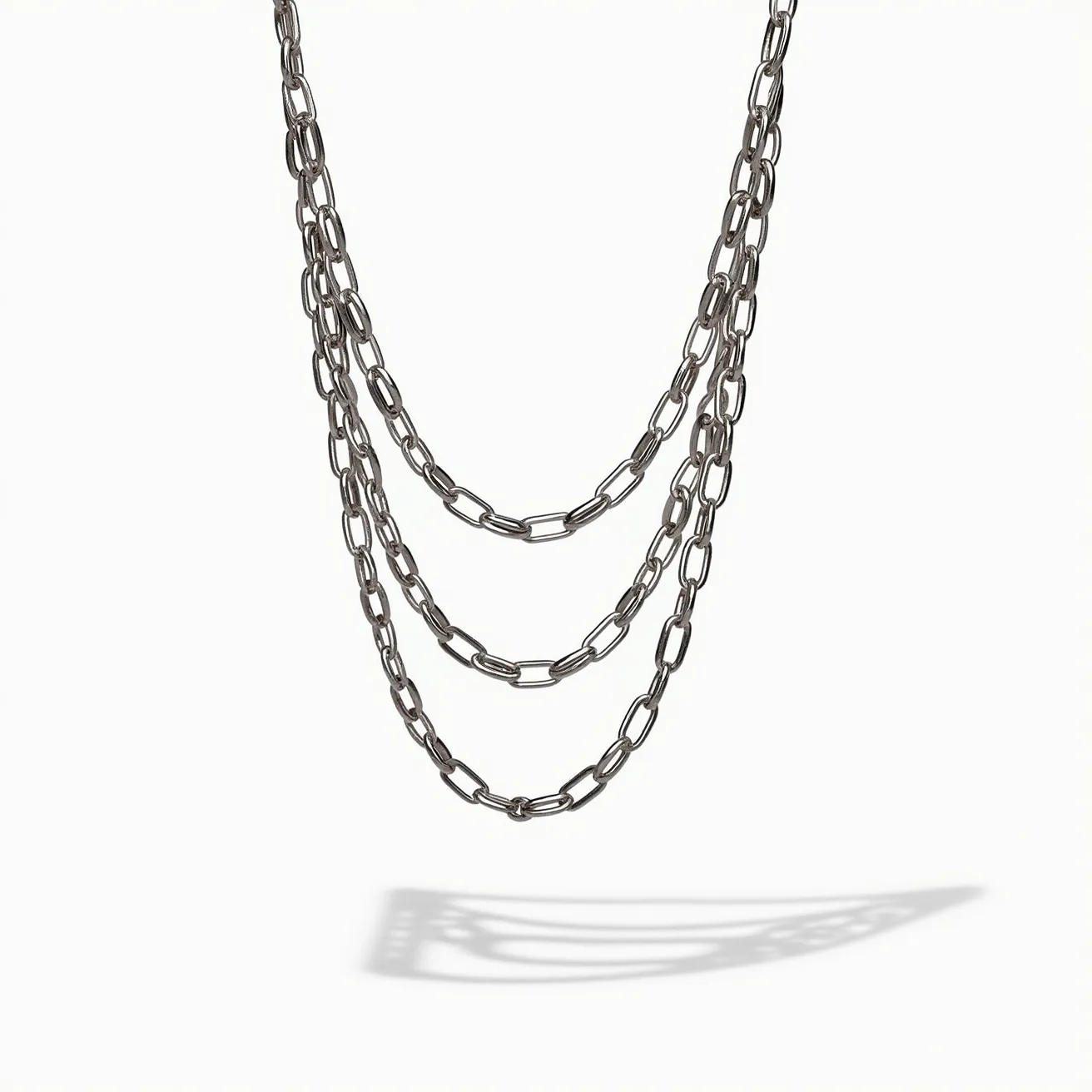 This white gold chain showcases a series of elongated, interconnected links that exhibit a sleek and polished finish, characteristic of white gold’s lustrous appeal. The chain is elegantly designed, with no additional gems or stones integrated into its structure. Each link contributes to the overall fluidity and sophistication of the piece, while the uniformity of the links highlights a classic, timeless style. The chain is completed with a standard clasp, ensuring secure attachment and ease of wear, making it a versatile accessory suitable for various occasions.