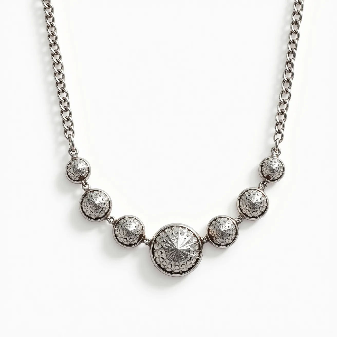 This white gold chain features a series of intricately designed circular elements, each set with a central gem that appears to be faceted in a starburst pattern, enhancing its brilliance. The stones are bezel-set, allowing for a secure fit while showcasing the gems’ entire surface. The chain itself consists of interlocking links, providing durability and a classic aesthetic. Each circular element is spaced evenly along the chain, contributing to a balanced and symmetrical design. The chain is equipped with a discreet clasp, ensuring a secure but elegant closure when worn.