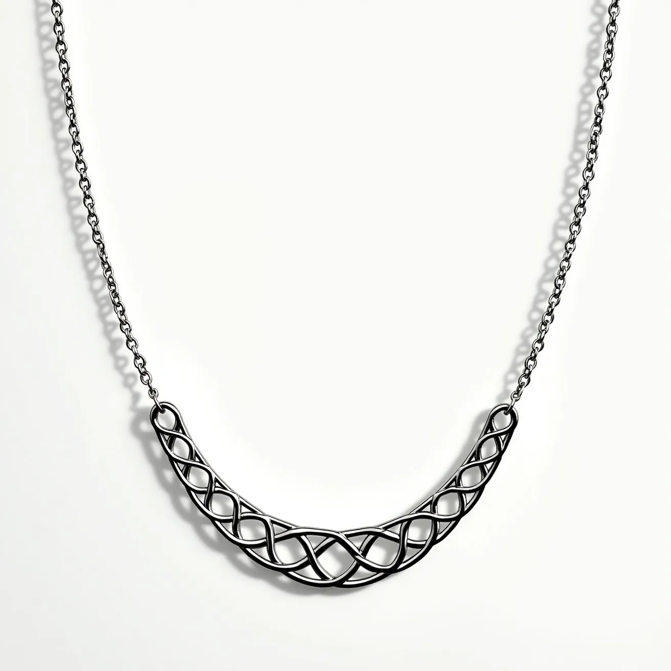 This white gold necklace features an intricate woven design as its central pendant, showcasing a series of interlocking loops that create a captivating pattern. The chain appears to be made of fine white gold links, complementing the elegant and modern style of the pendant. There are no visible gems or stones set within the necklace, allowing the intricate metalwork to stand out as the primary design element. The necklace is likely equipped with a standard clasp for secure attachment, ensuring ease of wear and a seamless look. The overall aesthetic is sophisticated and minimalist, making it a versatile accessory for various occasions.