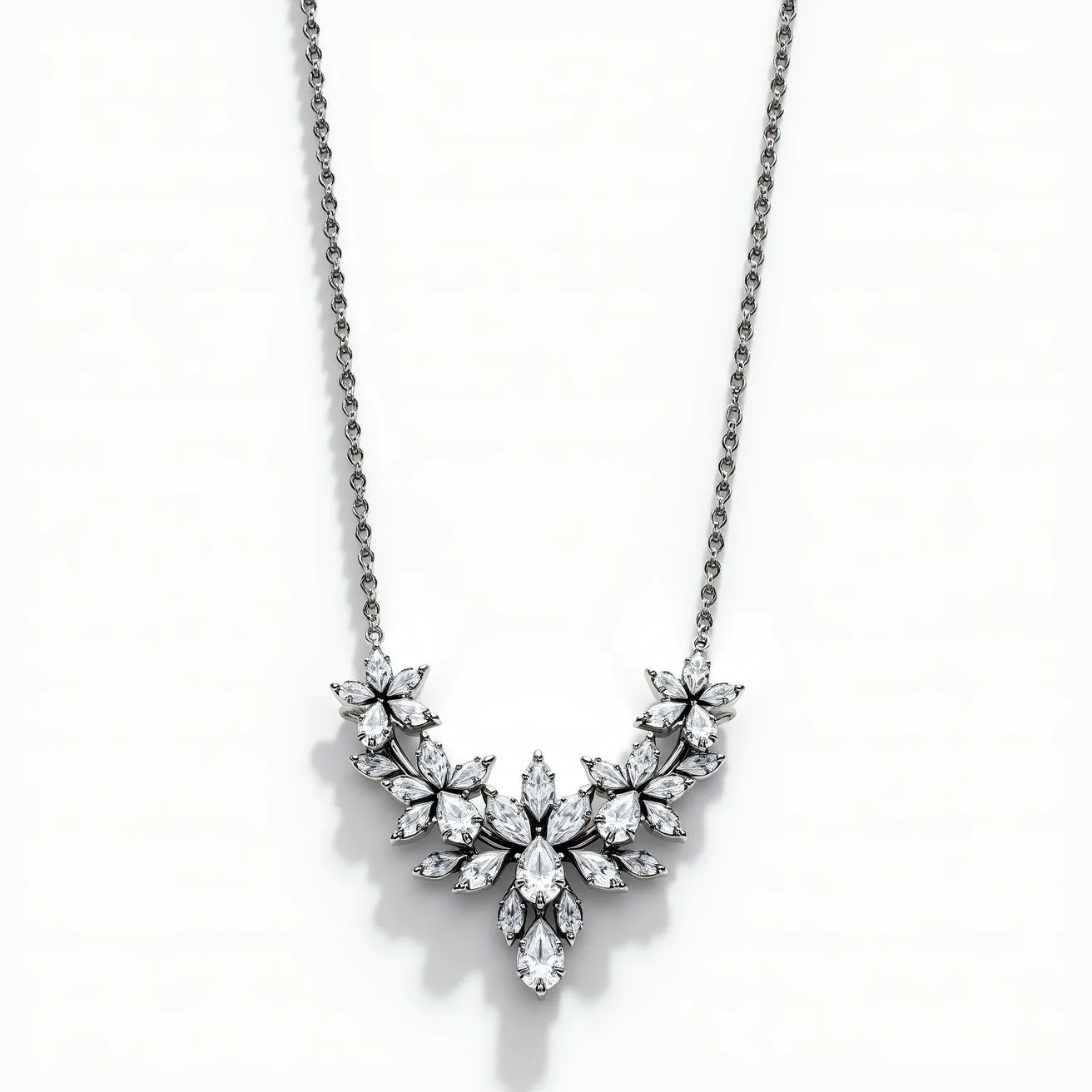 This white sapphire necklace features an elegant arrangement of marquise-cut and pear-shaped white sapphires, set in a floral motif that creates a sophisticated and eye-catching centerpiece. The stones are likely set in a white metal, possibly white gold, which complements the cool sparkle of the sapphires. The necklace chain appears to be crafted from the same metal, contributing to a cohesive and luxurious look. The necklace is equipped with a subtle clasp, designed to seamlessly blend with the chain while ensuring secure fastening for wear.