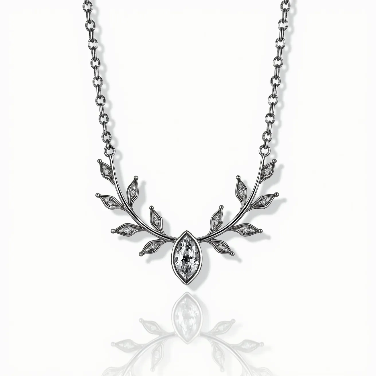 This white sapphire necklace features a marquise-cut white sapphire gemstone prominently set in the center, surrounded by a delicate pattern of leaf-like designs. The leaves are adorned with small, sparkling gems, possibly smaller white sapphires or cubic zirconia, to complement the central stone. These decorative elements are attached to a chain that appears to be made of a high-polish metal, likely white gold or sterling silver, which enhances the overall elegance of the piece. The necklace's chain links to the ornamental design seamlessly, suggesting craftsmanship attention to detail. A secure clasp, likely a lobster or spring-ring clasp, ensures the necklace stays fastened when worn.