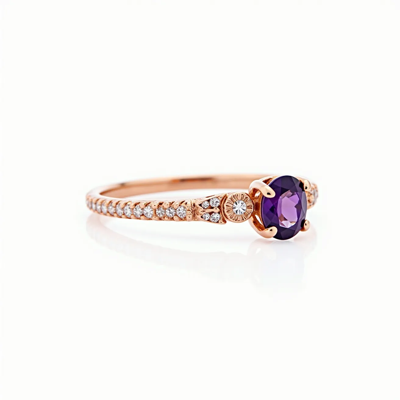 This amethyst promise ring features a central oval-cut amethyst set in a four-prong setting, which accentuates its deep purple hue. The band appears to be crafted from rose gold, lending a warm, romantic glow to the piece. Flanking the central stone are small round diamonds set into the band, adding a touch of sparkle and elegance. The diamonds are arranged closely along the shank, complementing the central amethyst and enhancing the ring's overall brilliance. The combination of the amethyst with the rose gold and diamonds creates a harmonious and sophisticated design.