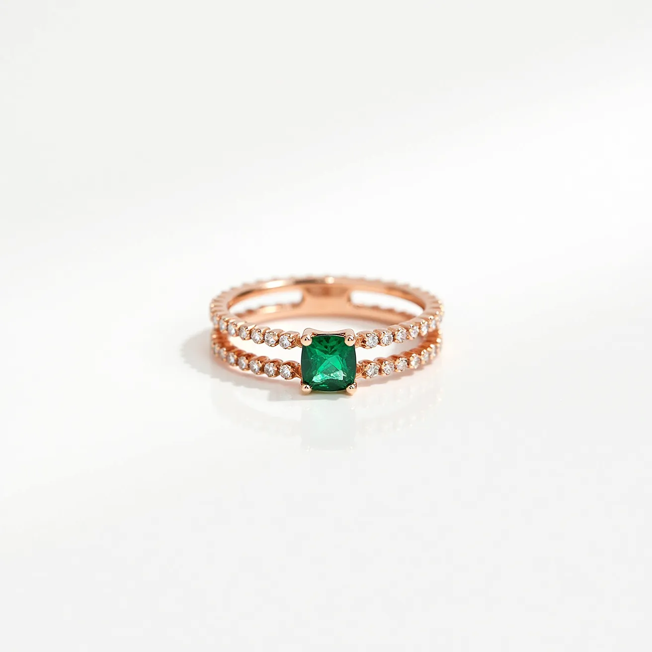 These birthstone stackable rings feature a stunning emerald as the centerpiece, with a square cut that highlights its rich green color. The emerald is set in a classic prong setting, allowing for maximum visibility and light reflection. The rings themselves are adorned with small, round-cut white stones, possibly diamonds or cubic zirconia, intricately set along the bands. Crafted from rose gold, the bands offer a warm, elegant contrast to the vibrant emerald. These rings are designed to be worn together, perfectly complementing each other in a stackable fashion.