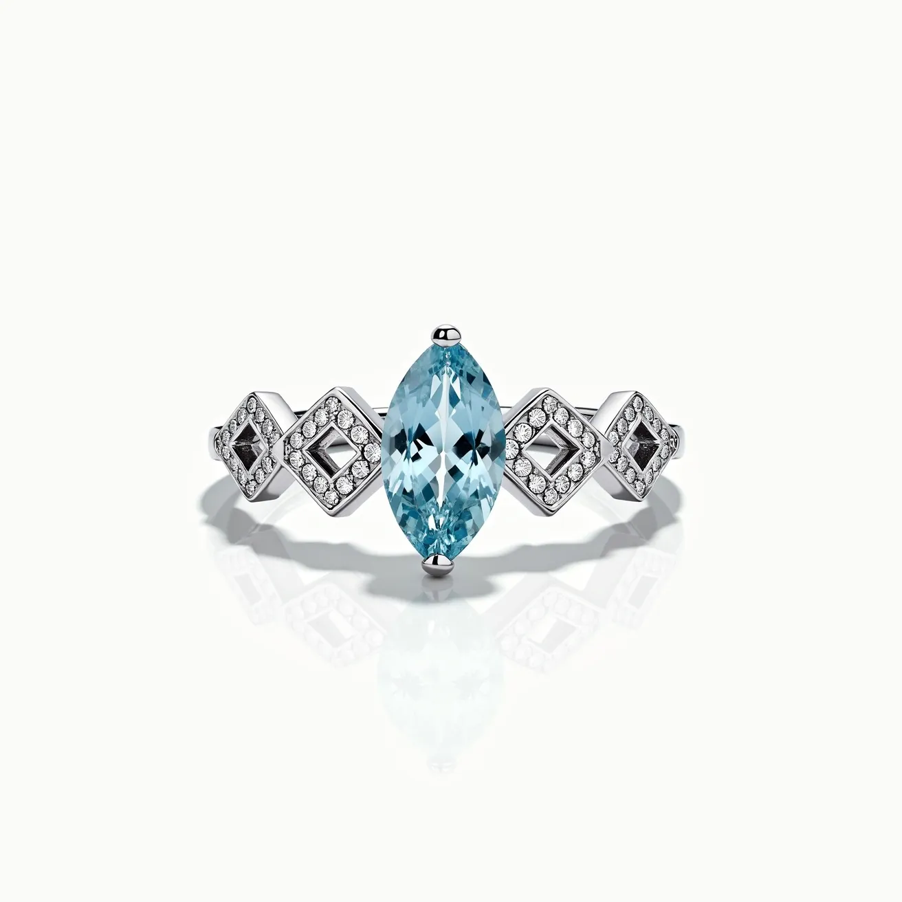 This chevron ring features a central marquise-cut aquamarine gemstone, set prominently in a sleek, polished metal band, likely made of white gold or platinum. The aquamarine is flanked by a series of geometric, diamond-studded designs, with smaller round-cut diamonds set in a pave style surrounding square and diamond-shaped motifs, enhancing the ring's sparkle and modern aesthetic. The intricate detailing of the stones creates a striking balance between the cool blue of the aquamarine and the brilliant gleam of the surrounding diamonds.