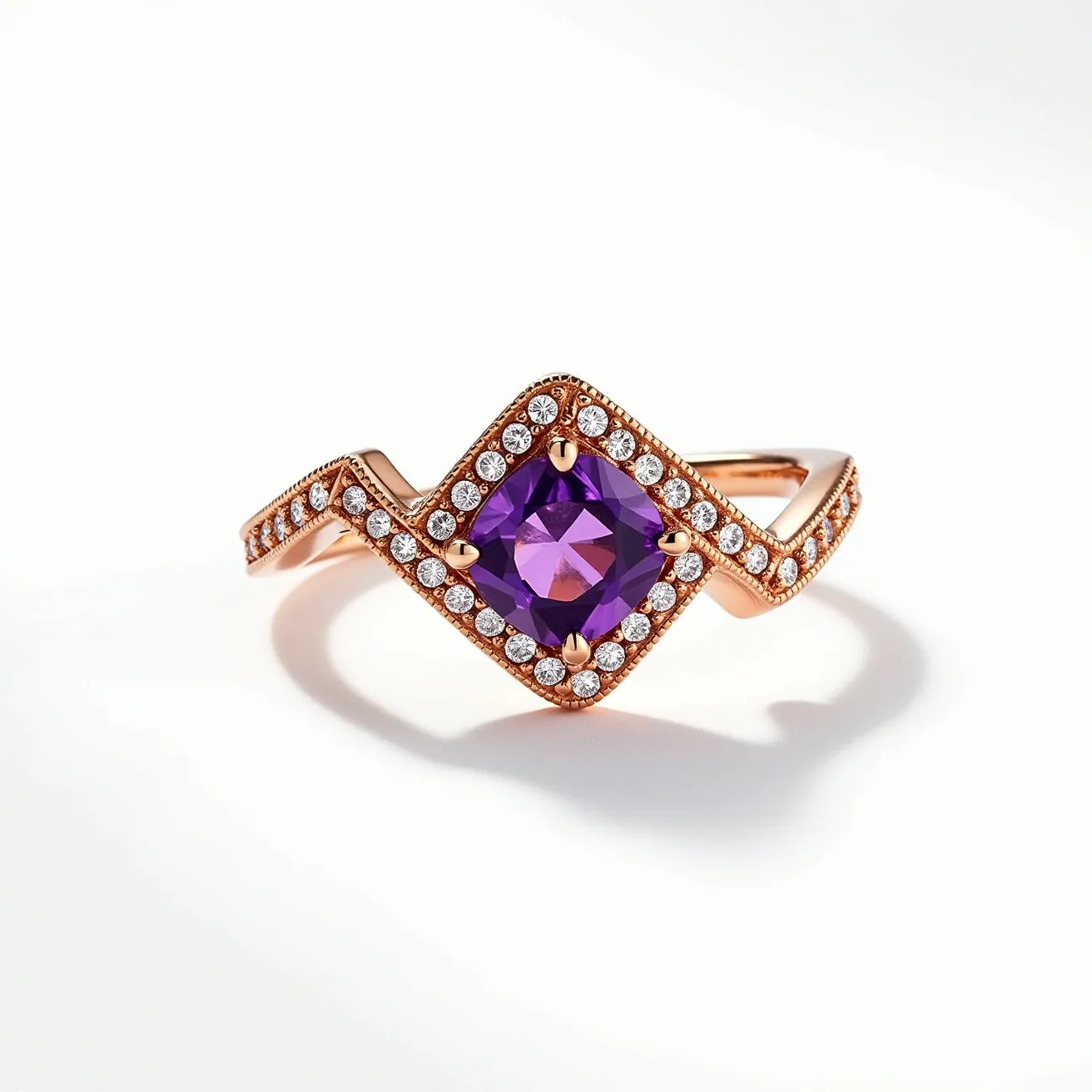 This chevron ring features a striking design crafted from rose gold, forming a distinct V shape. At its center, it showcases a cushion-cut purple gemstone, securely held in a prong setting, which adds a vibrant pop of color. The band is elegantly adorned with smaller round white diamonds that are pave set, enhancing the overall sparkle and sophistication of the piece. The combination of the rich purple stone with the surrounding diamonds and the warm tone of the gold creates an eye-catching and luxurious aesthetic.