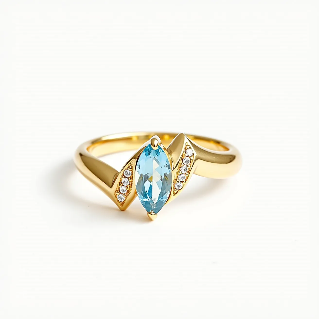 This chevron ring showcases a striking design with a gold band that features a prominent marquise-cut blue gemstone at its center. The gemstone is set in a prong setting, enhancing its brilliance and focal presence. Flanking the central stone are two chevron-shaped sections, each embellished with a row of round white gemstones, likely diamonds, set in a pave style. The combination of the central marquise stone and the accent stones adds elegance and sparkle, making the ring a captivating piece of jewelry.