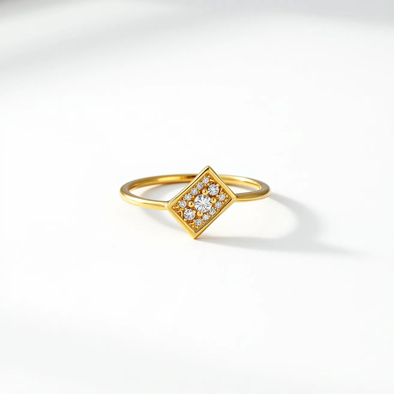 This chevron ring features a delicate gold band that elegantly supports a geometric diamond-shaped centerpiece. The centerpiece is intricately set with sparkling round-cut gems, likely diamonds, arranged in a cluster that enhances the ring's brilliance. The gems are securely held in place by a bezel setting, which adds to the ring's sleek and modern design. The ring does not include any clasps or additional attachments, focusing on the simplicity and elegance of the chevron shape and the diamond arrangement.