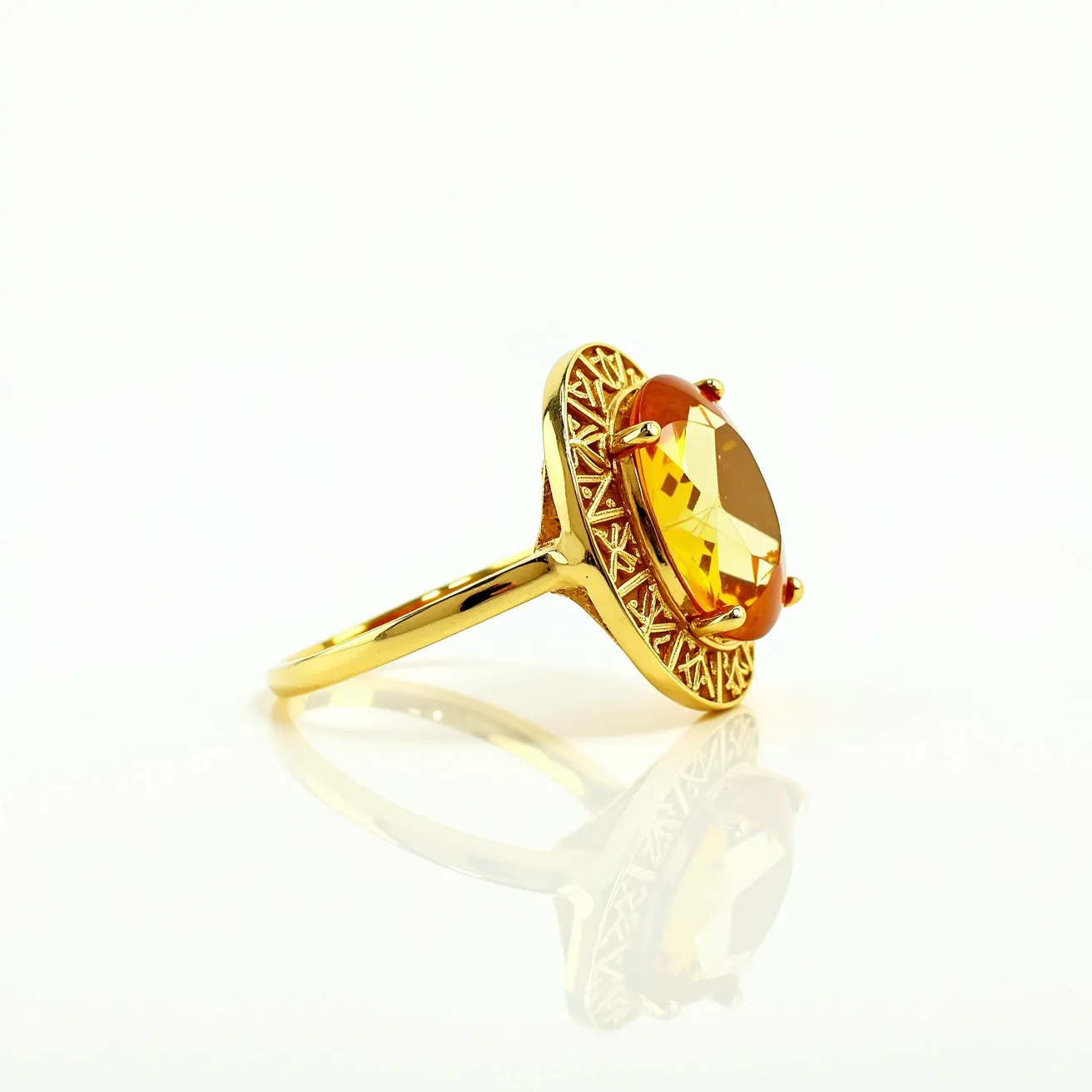 This citrine ring showcases a large, faceted citrine gemstone as its centerpiece, held securely in a prong setting that accentuates its vibrant golden hue. The band and setting are crafted from polished gold, providing a warm and complementary backdrop to the citrine's brilliance. Surrounding the gemstone is an intricately designed gold halo with geometric patterns that add an elegant touch to the ring’s aesthetic. The overall design of the ring combines classic and modern elements, making it a versatile piece for various occasions.