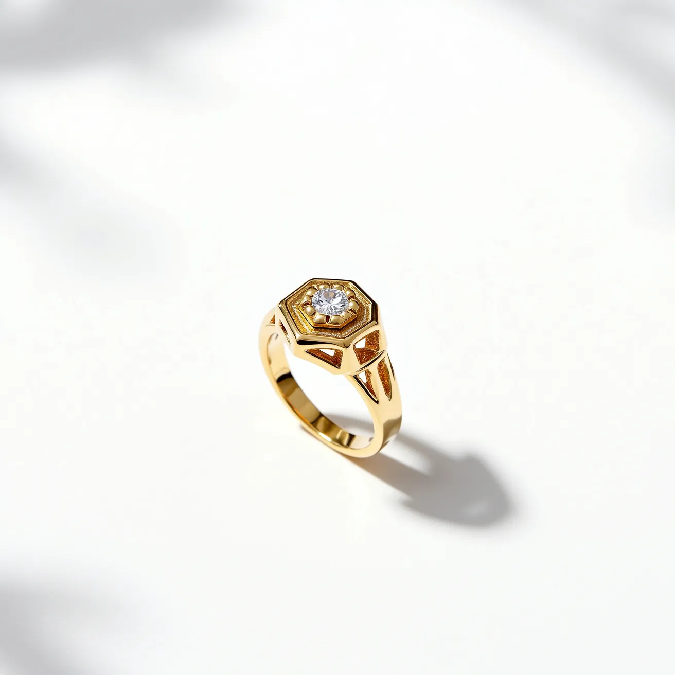 This cocktail ring features a striking combination of gold metalwork and a prominent, centrally placed gemstone. The centerpiece is a round-cut diamond set within a geometric hexagonal setting, enhancing its brilliance and adding a touch of contemporary elegance. The band itself is crafted from polished gold, complementing the diamond's sparkle and contributing to the ring's luxurious appearance. The thoughtful design and precise craftsmanship make this ring an eye-catching accessory.