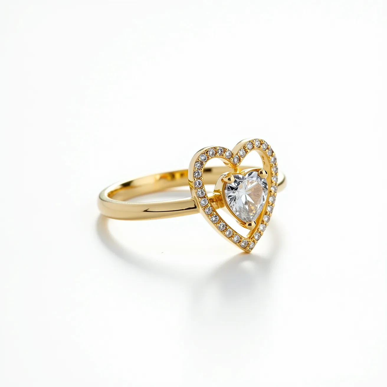 This diamond heart ring features a delicate design crafted in gold, showcasing a central heart-shaped diamond as the focal point. The heart-shaped diamond is set in a prong setting, enhancing its brilliance and allowing ample light to pass through the gem. Surrounding the central diamond is a heart-shaped frame adorned with small, round-cut diamonds, adding extra sparkle to the piece. The band is a sleek, polished gold, providing an elegant contrast to the shimmering diamonds. The design is both modern and romantic, capturing the essence of sophisticated style.