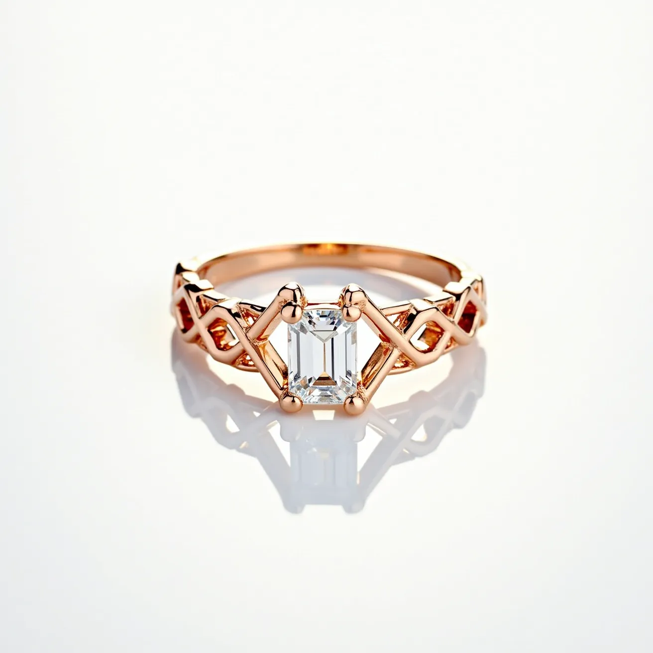 This diamond ring features a central emerald-cut diamond set in an intricate rose gold band. The diamond is held in place by four prongs that accentuate its clear, linear facets, typical of the emerald cut, which offers a sophisticated and elegant appearance. The band is designed with an intricate lattice-like pattern, adding a modern touch to the classical allure of the ring. The rose gold material gives it a warm and luxurious glow, complementing the clarity and brilliance of the diamond, making it a striking piece of jewelry.